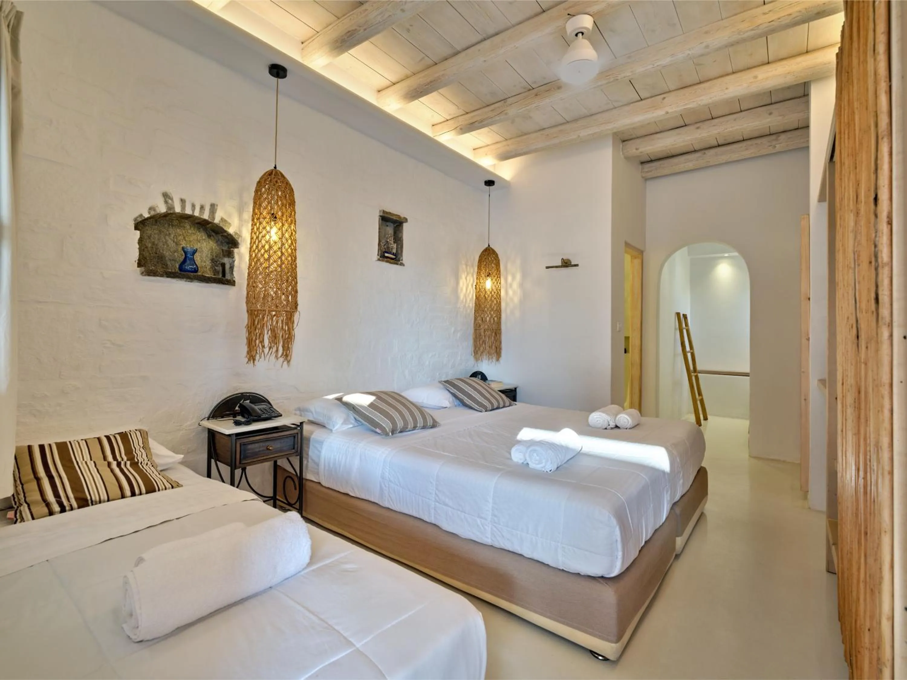 Bed in Zefi Hotel & Suites