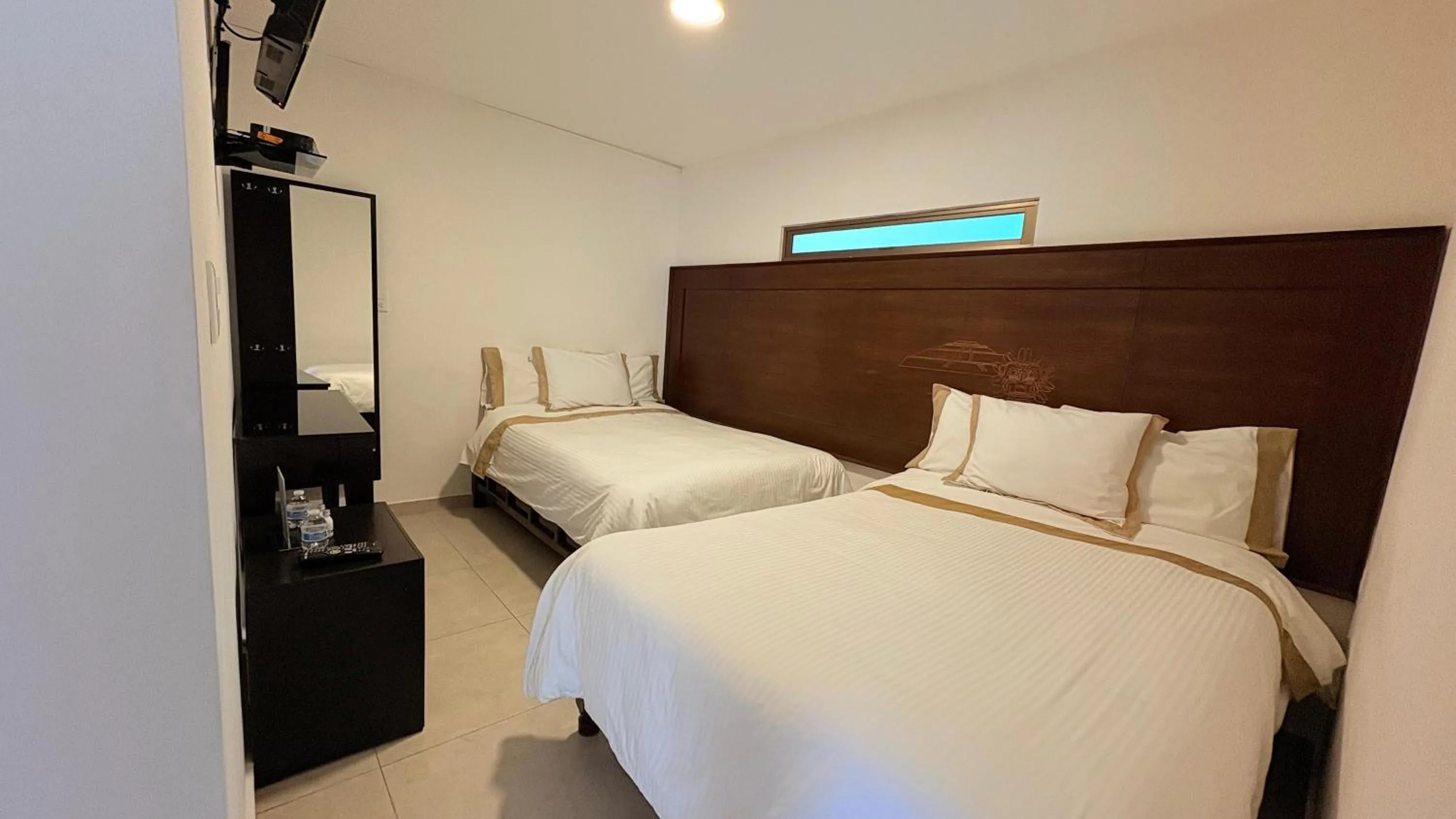 Bed in Hotel Boutique Yaocalli