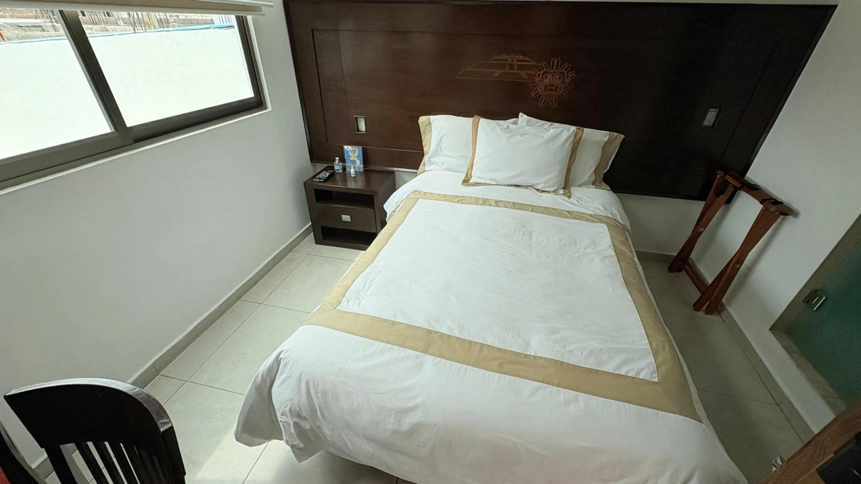 Bed in Hotel Boutique Yaocalli