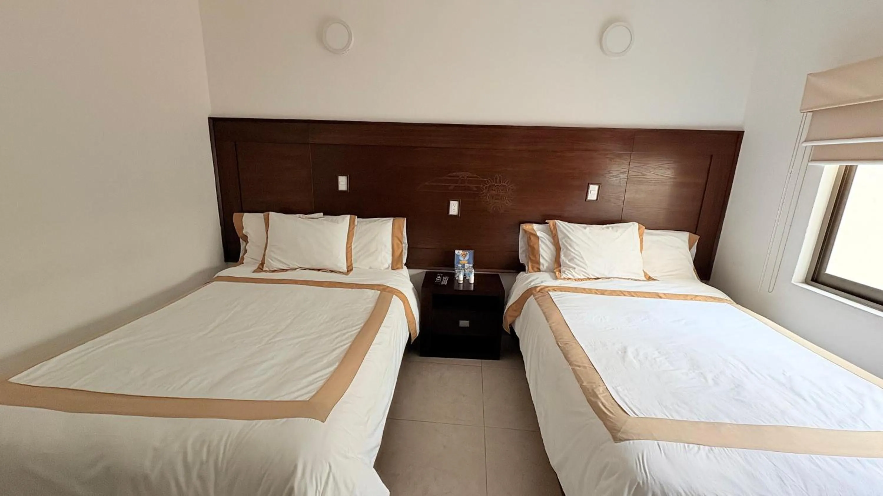 Bed in Hotel Boutique Yaocalli