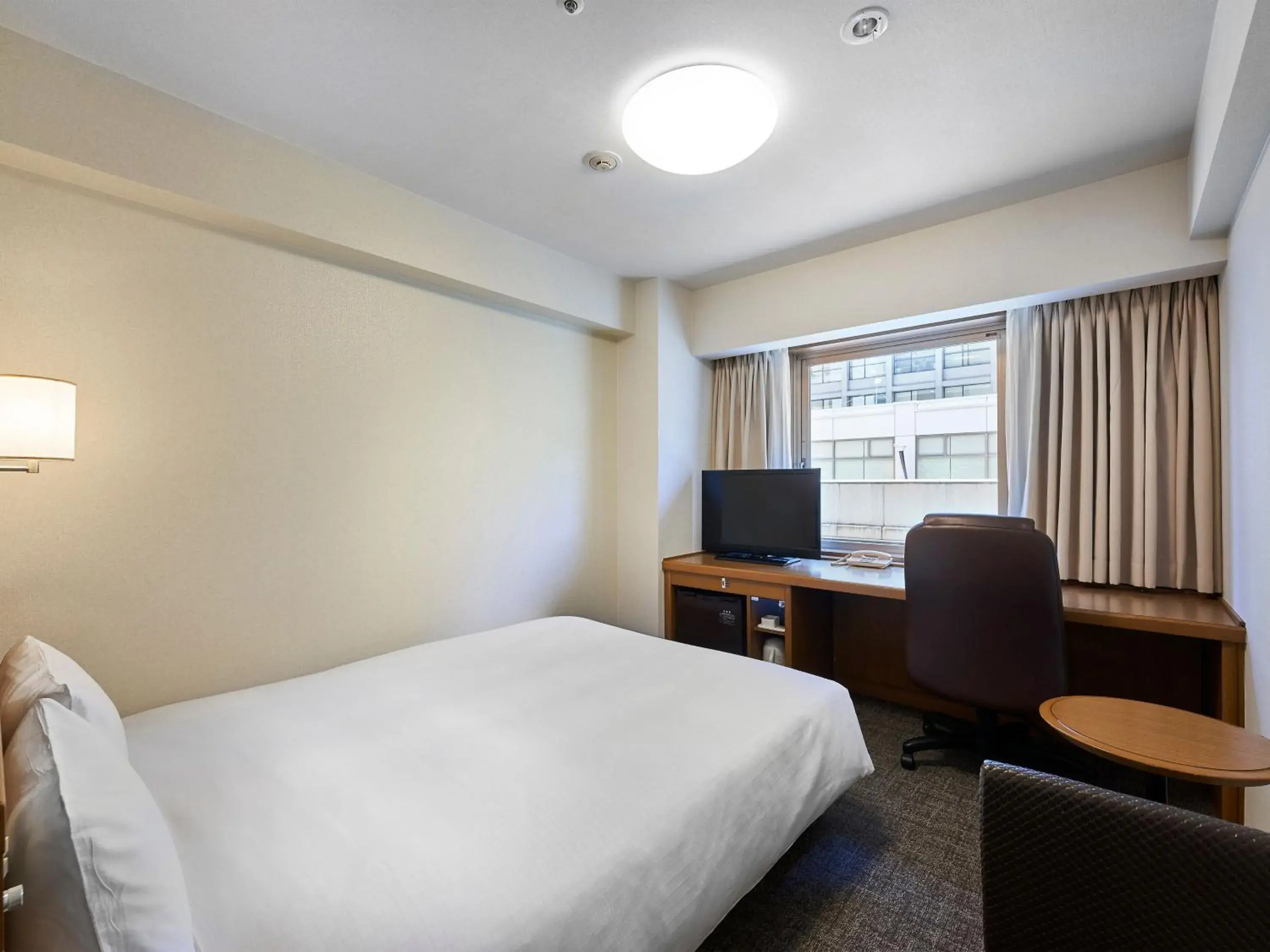 Bed in Daiwa Roynet Hotel Kobe Sannomiya Bed in Daiwa Roynet Hotel Kobe Sannomiya