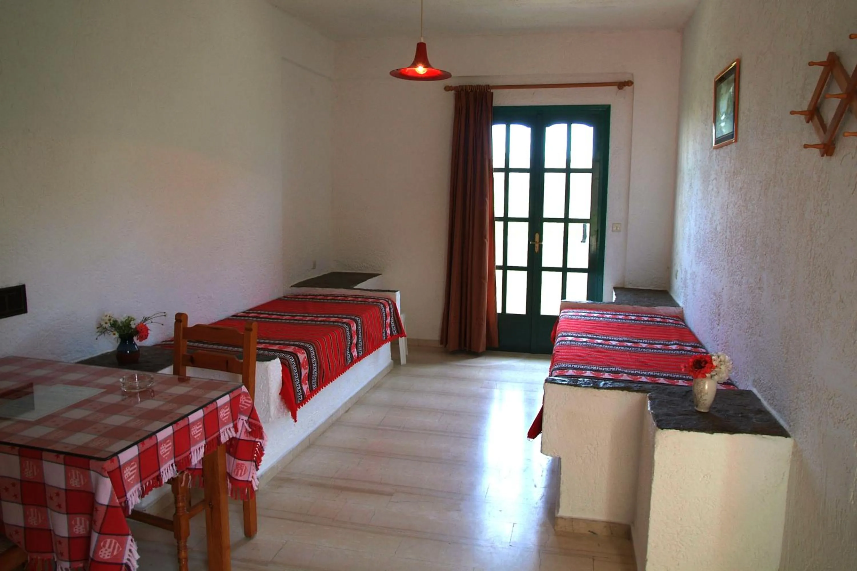 Bed in Prinos Apartments