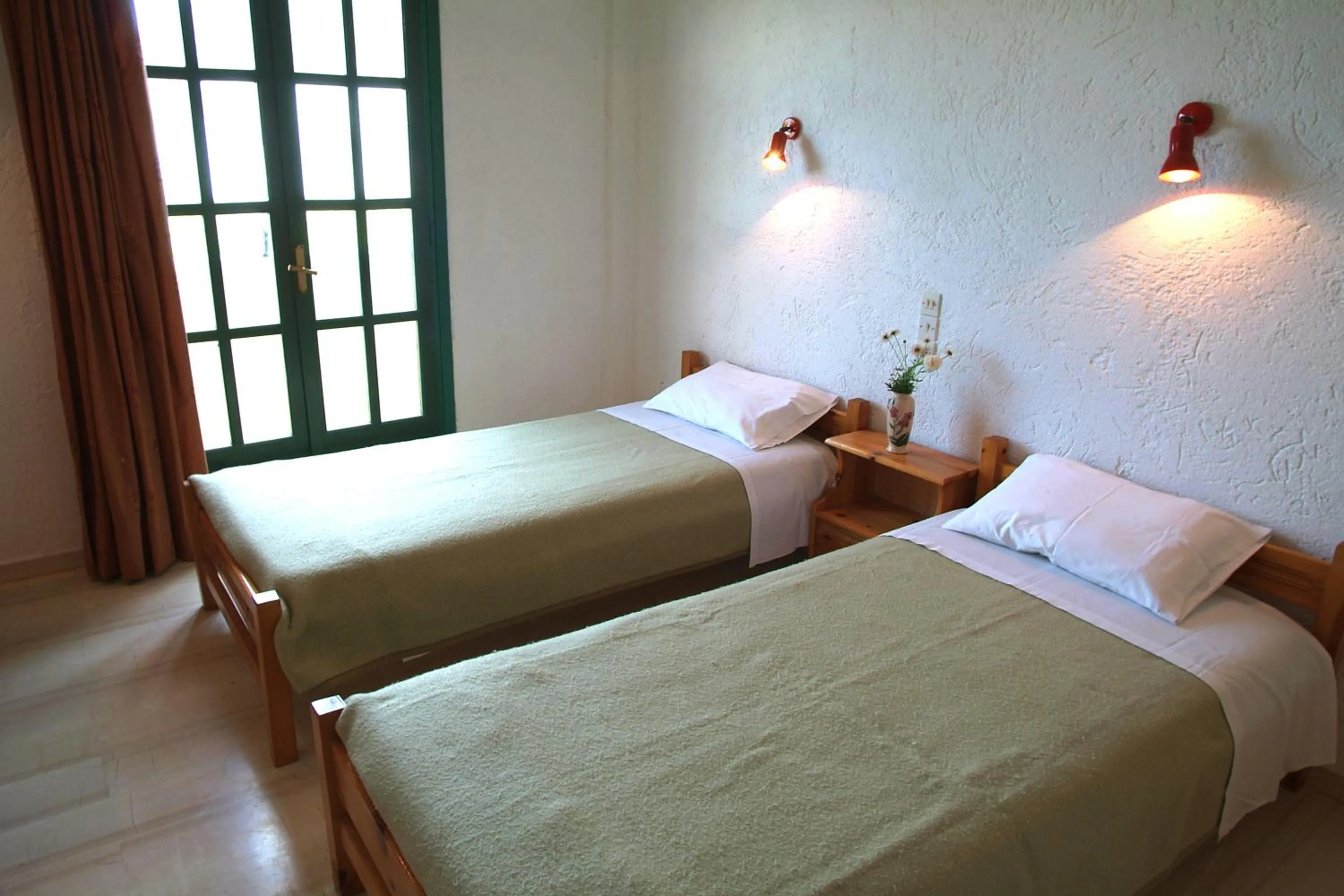 Bed in Prinos Apartments