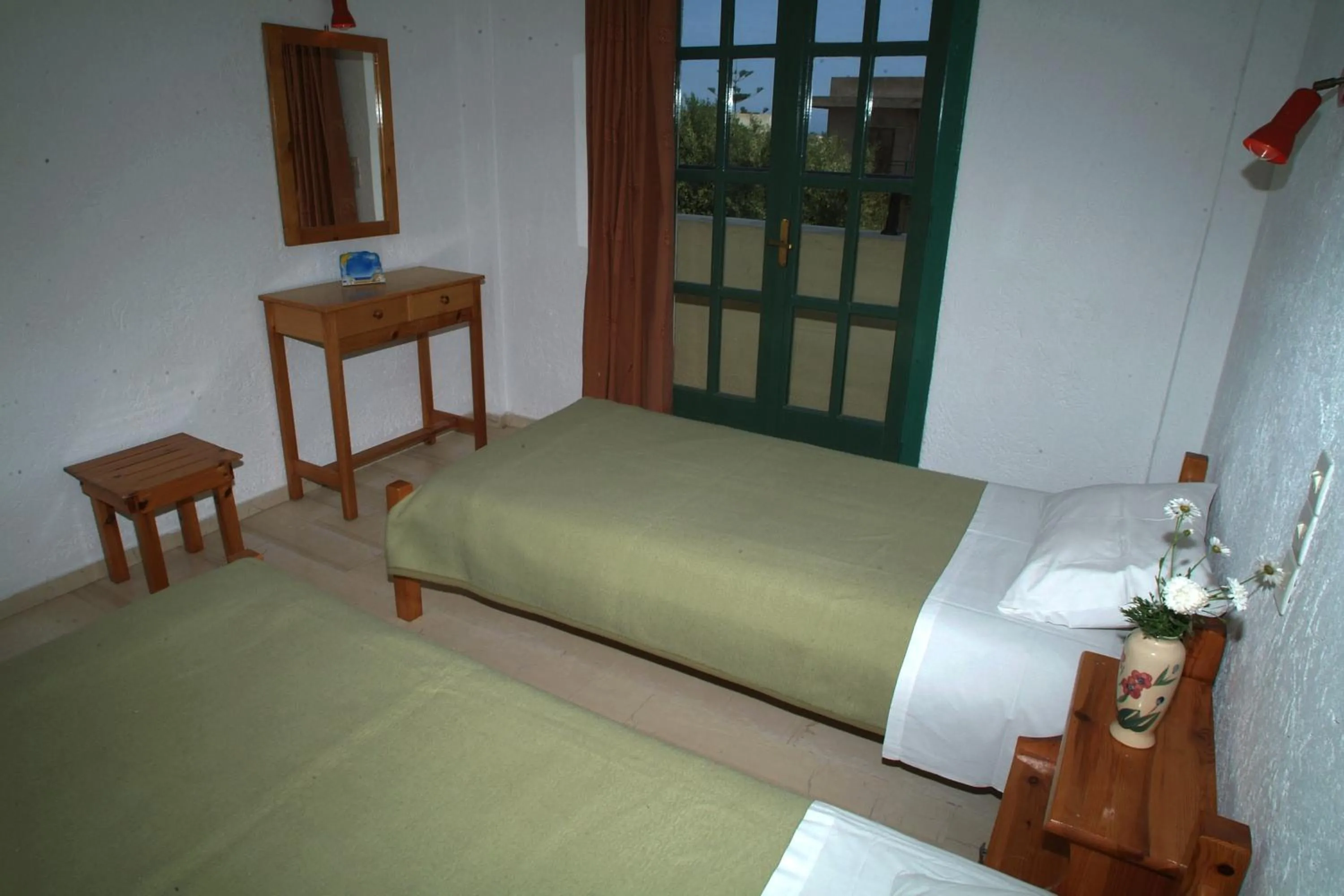 Bed in Prinos Apartments