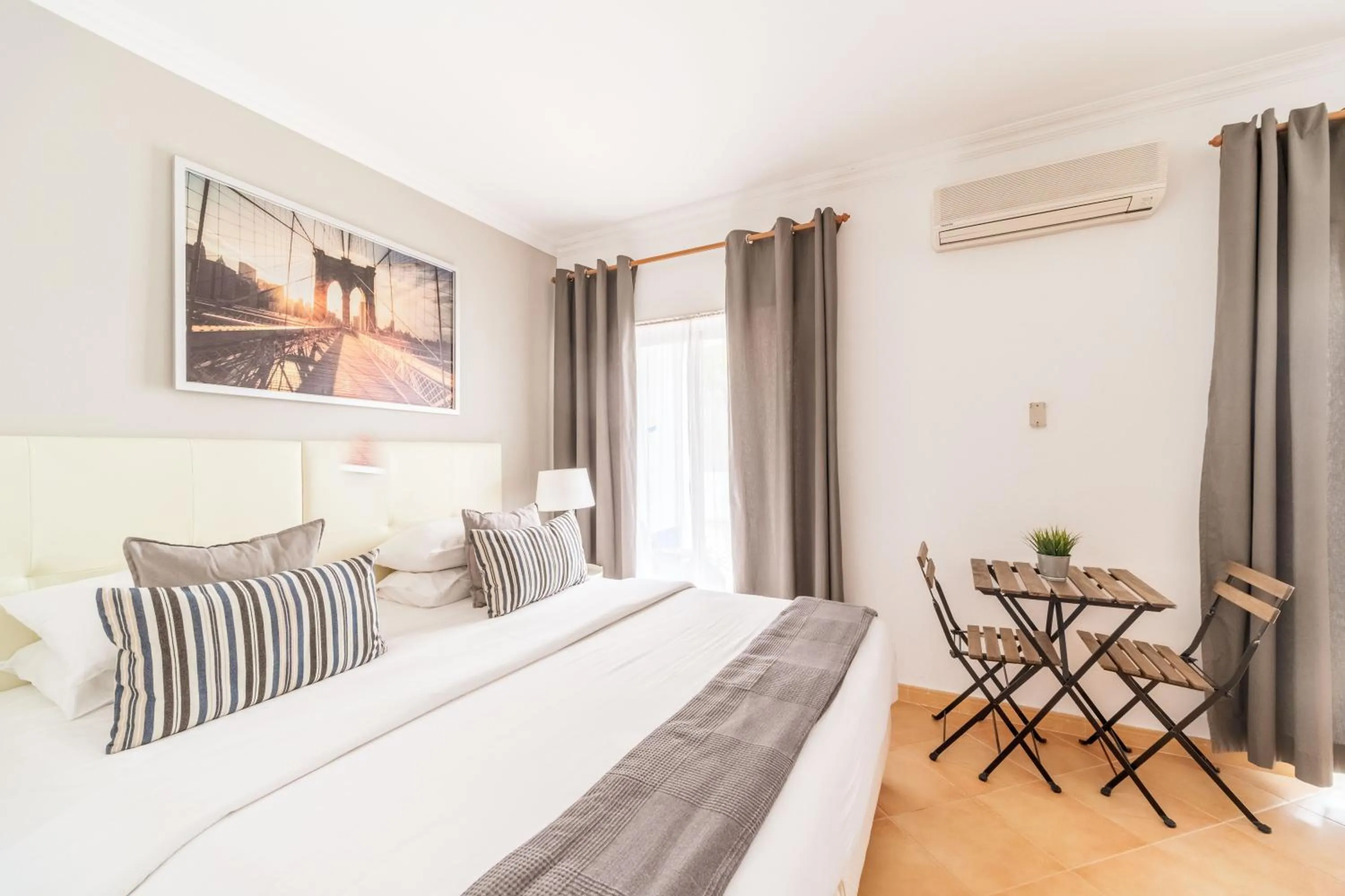 Bed in Oasis Beach Apartments