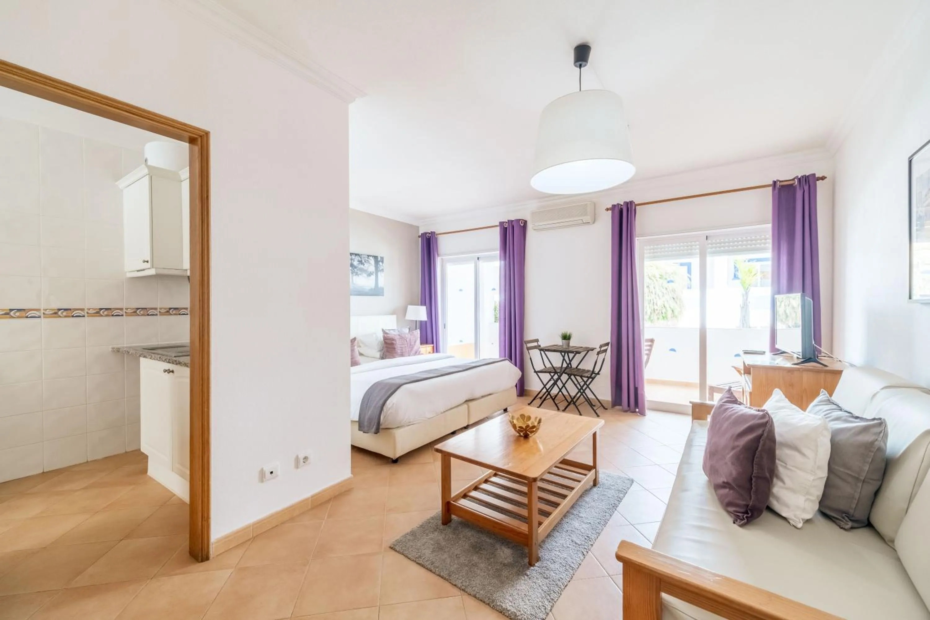 Bed in Oasis Beach Apartments