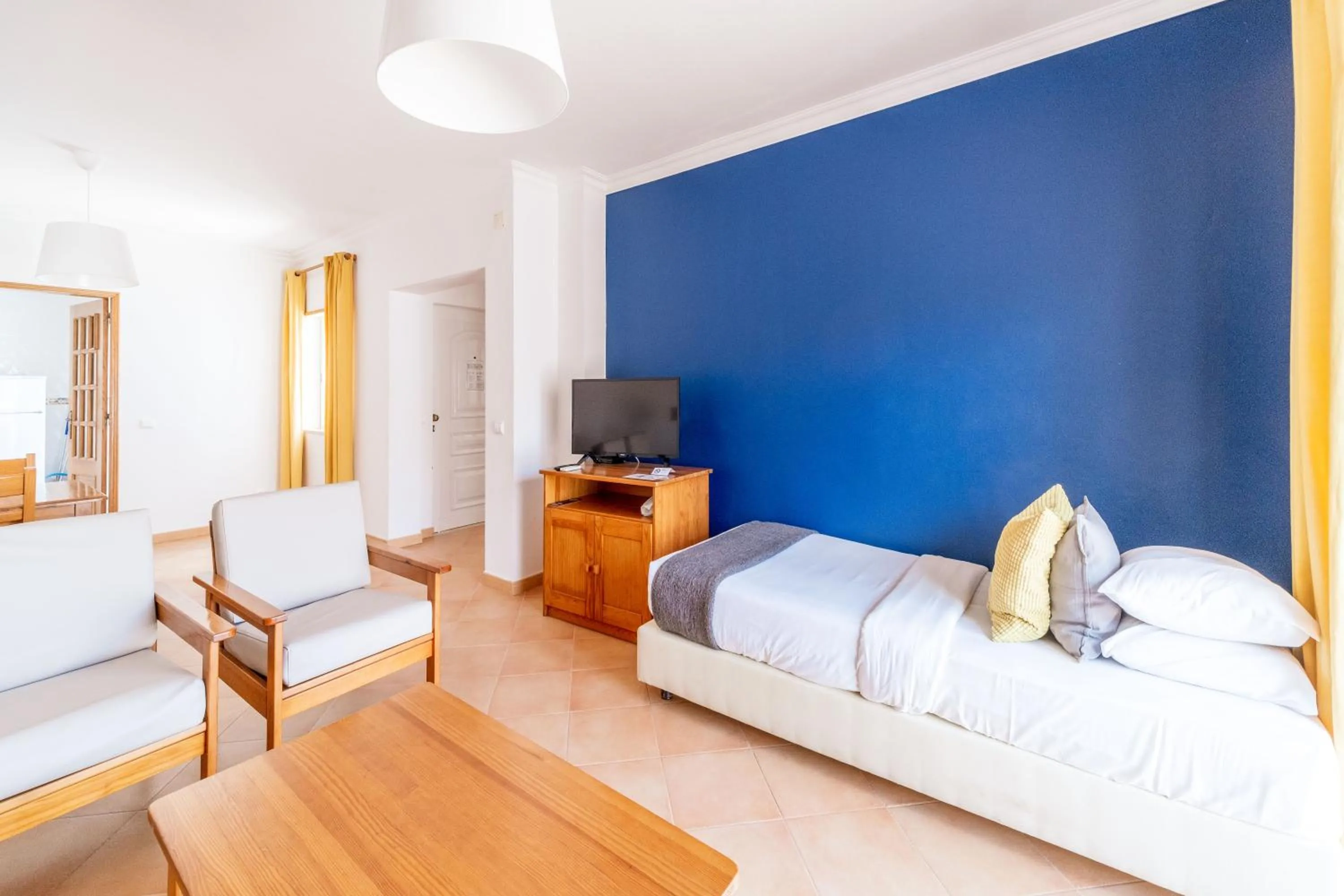 Living room, Bed in Oasis Beach Apartments