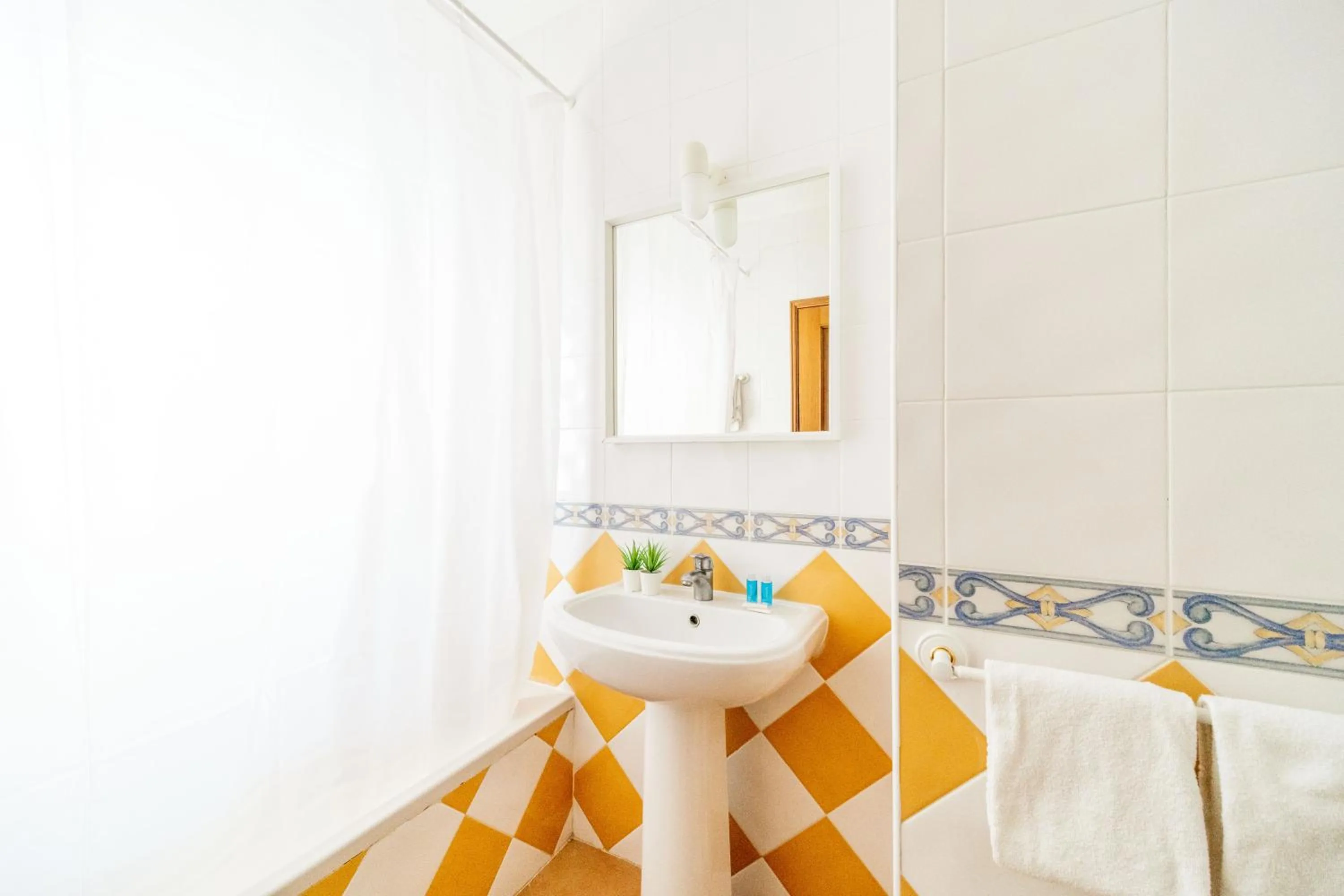 Bathroom in Oasis Beach Apartments