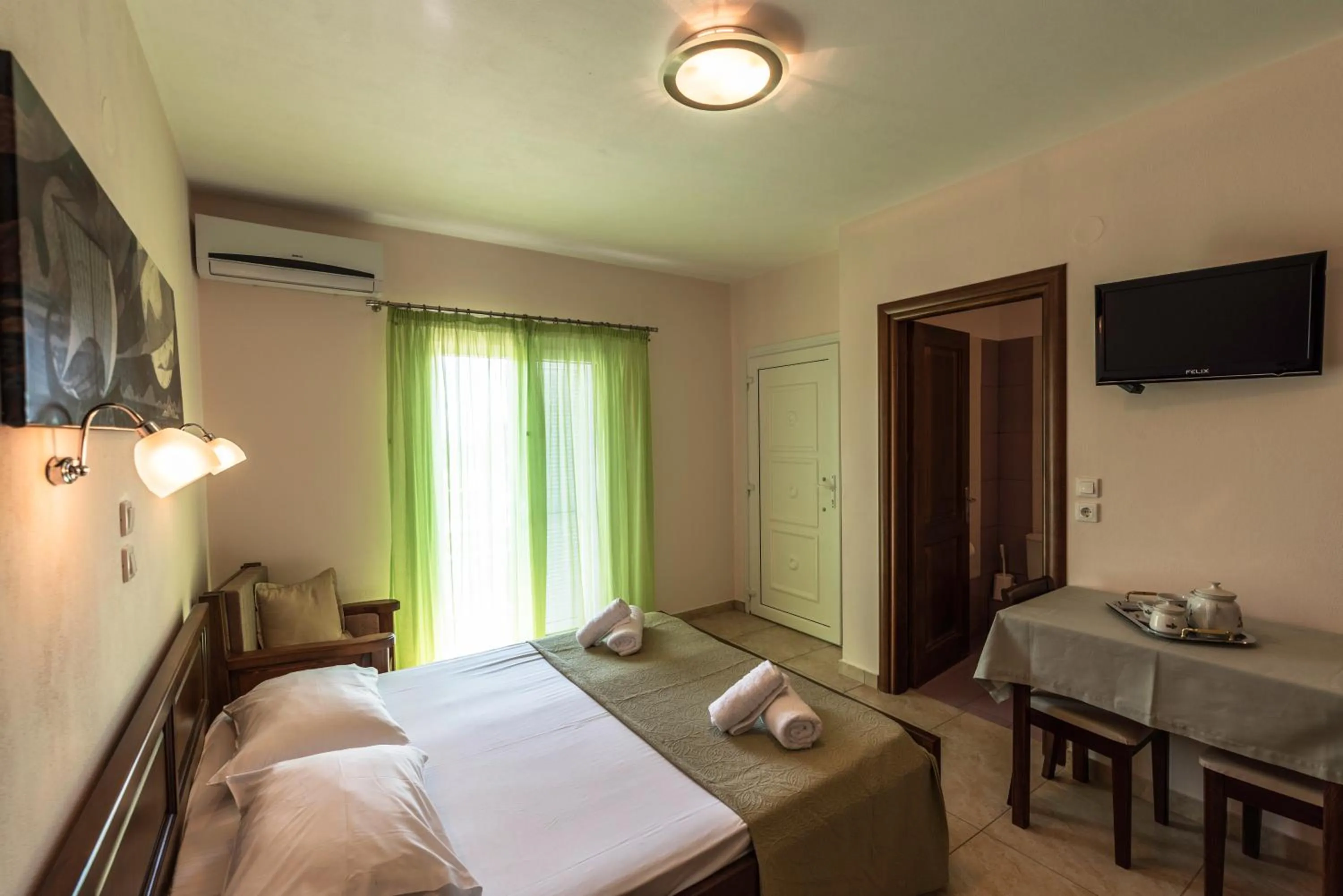 Bed in Zeus Apartments