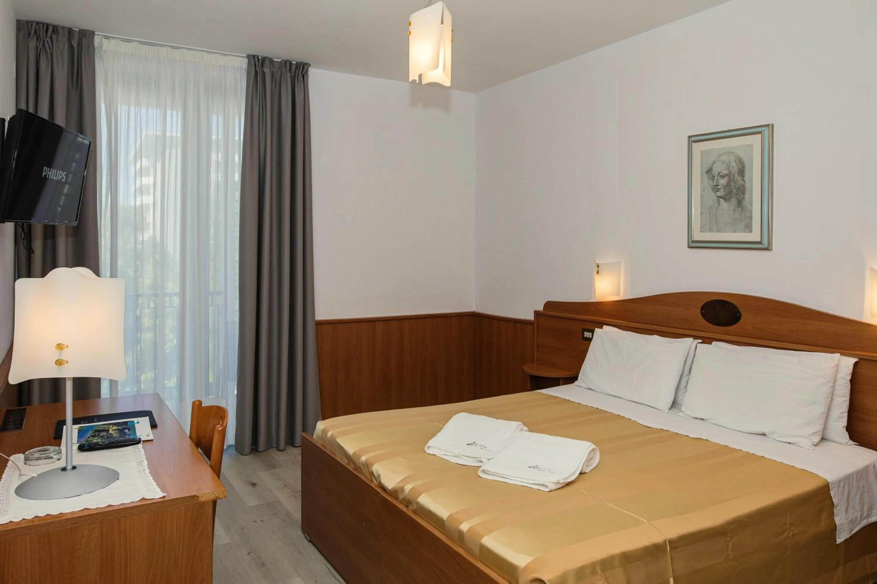 Bed in Hotel Leonardo Da Vinci Wellness SPA