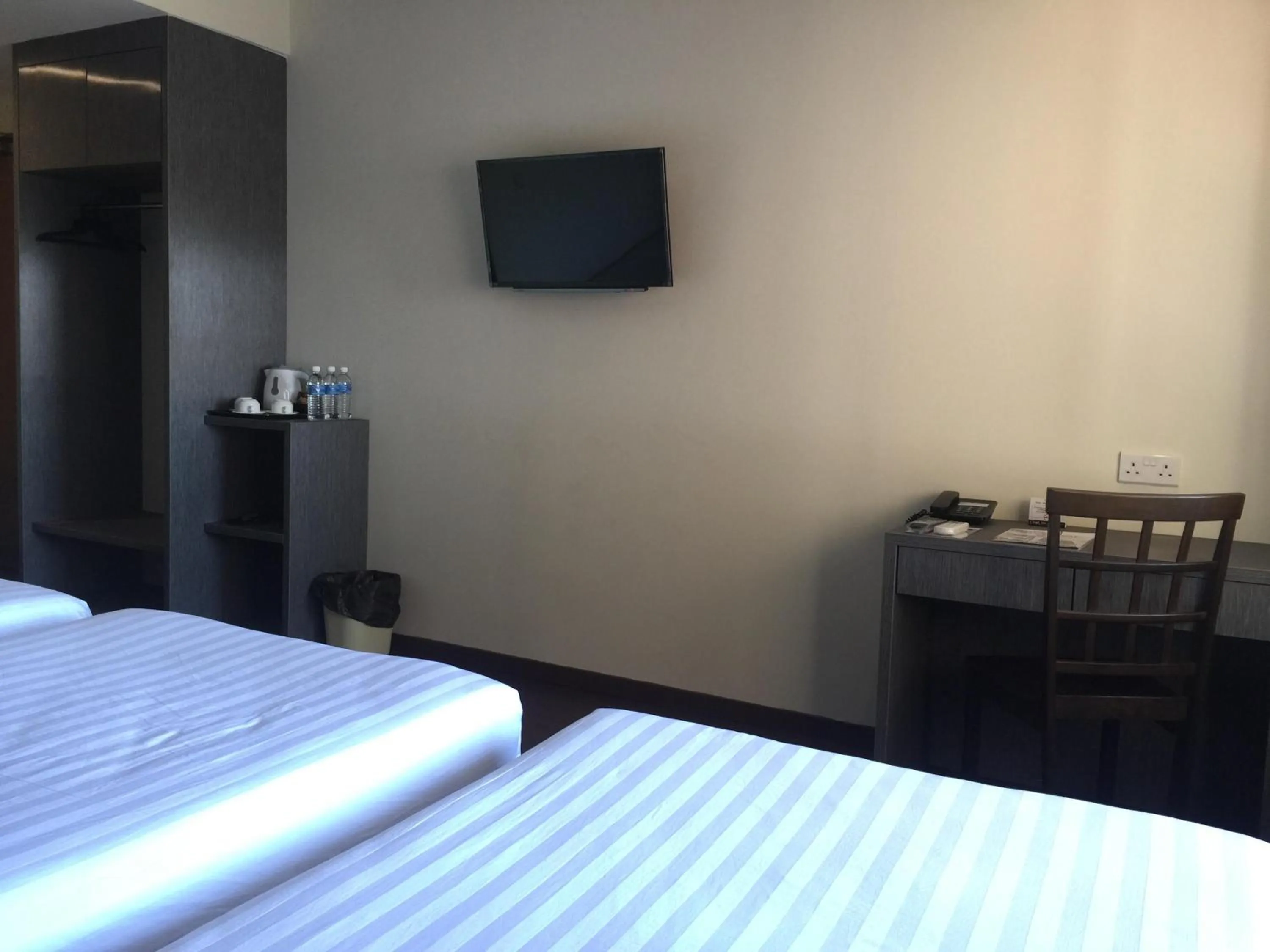 Bed in Check Inn Hotel Tawau