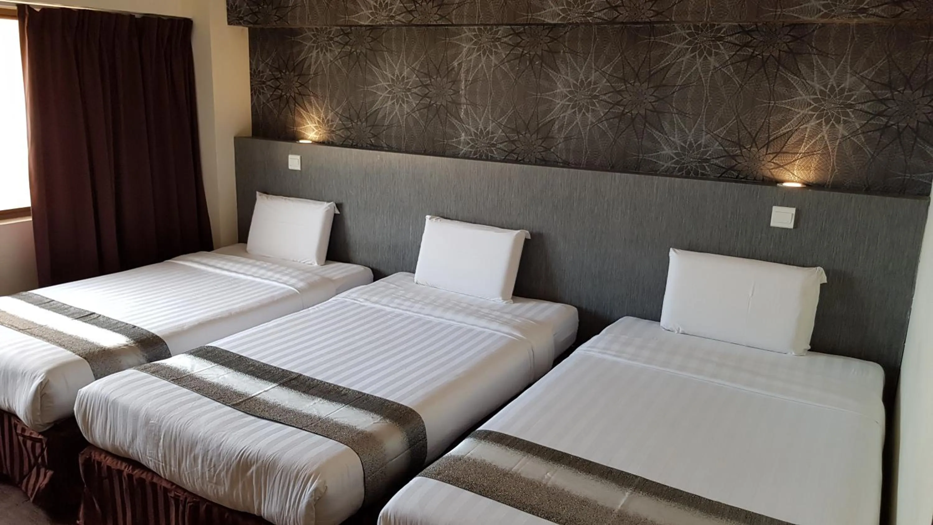 Bed in Check Inn Hotel Tawau