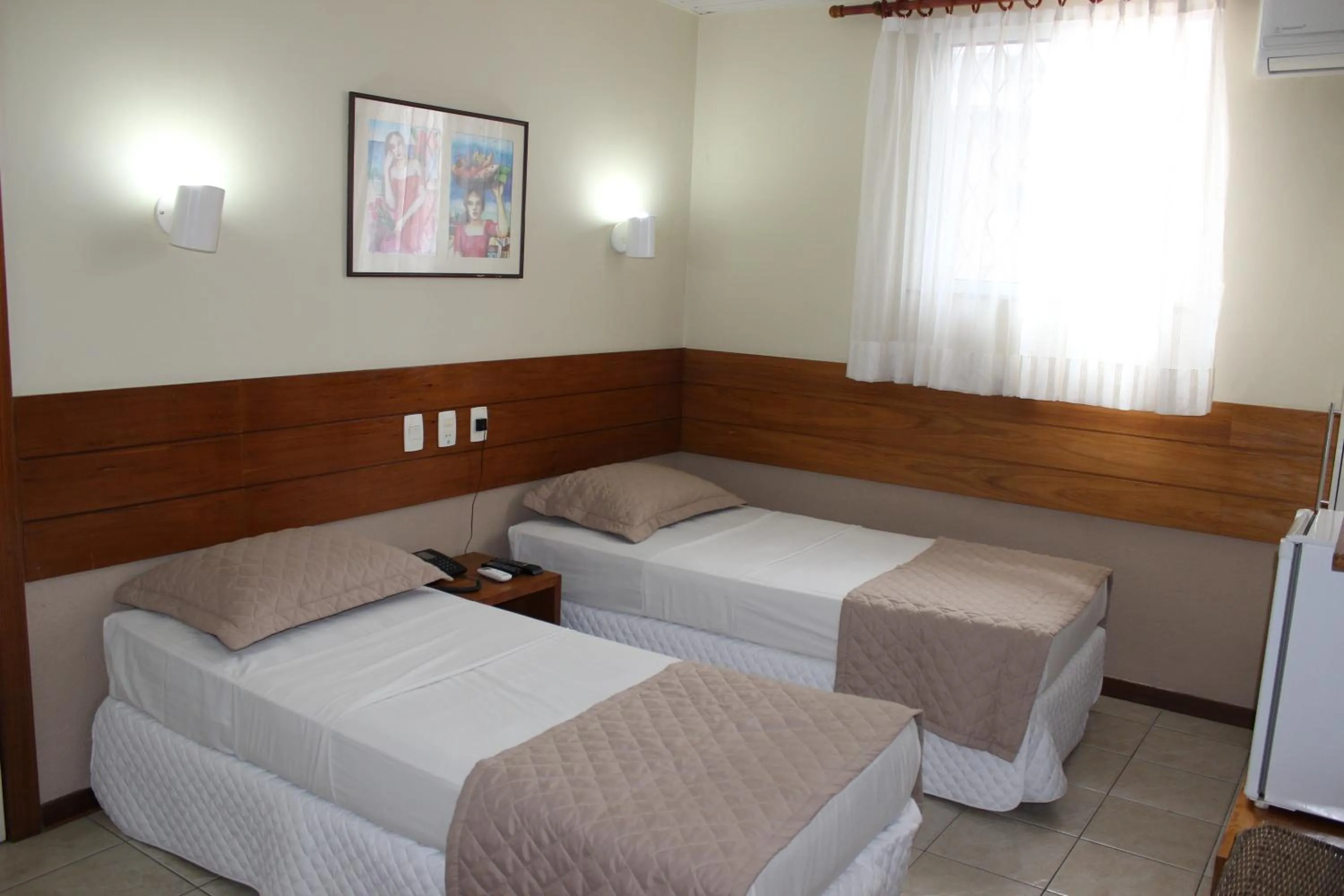 Bed in Portal Da Praia Hotel