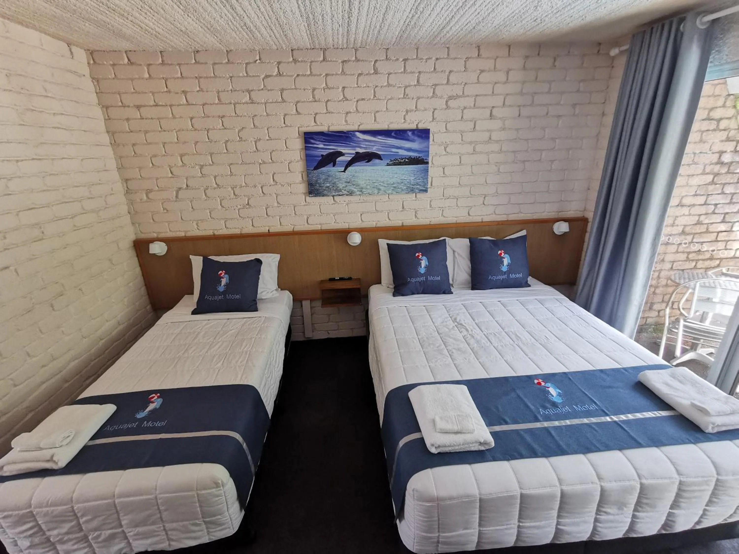 Bed in Aquajet Motel