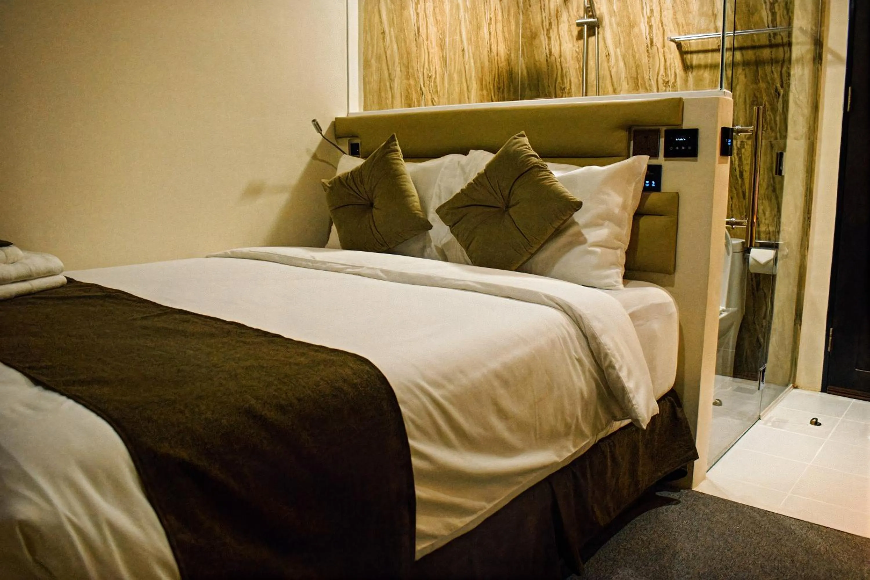 Bed in Cebu Dulcinea Hotel and Suites-MACTAN AIRPORT HOTEL