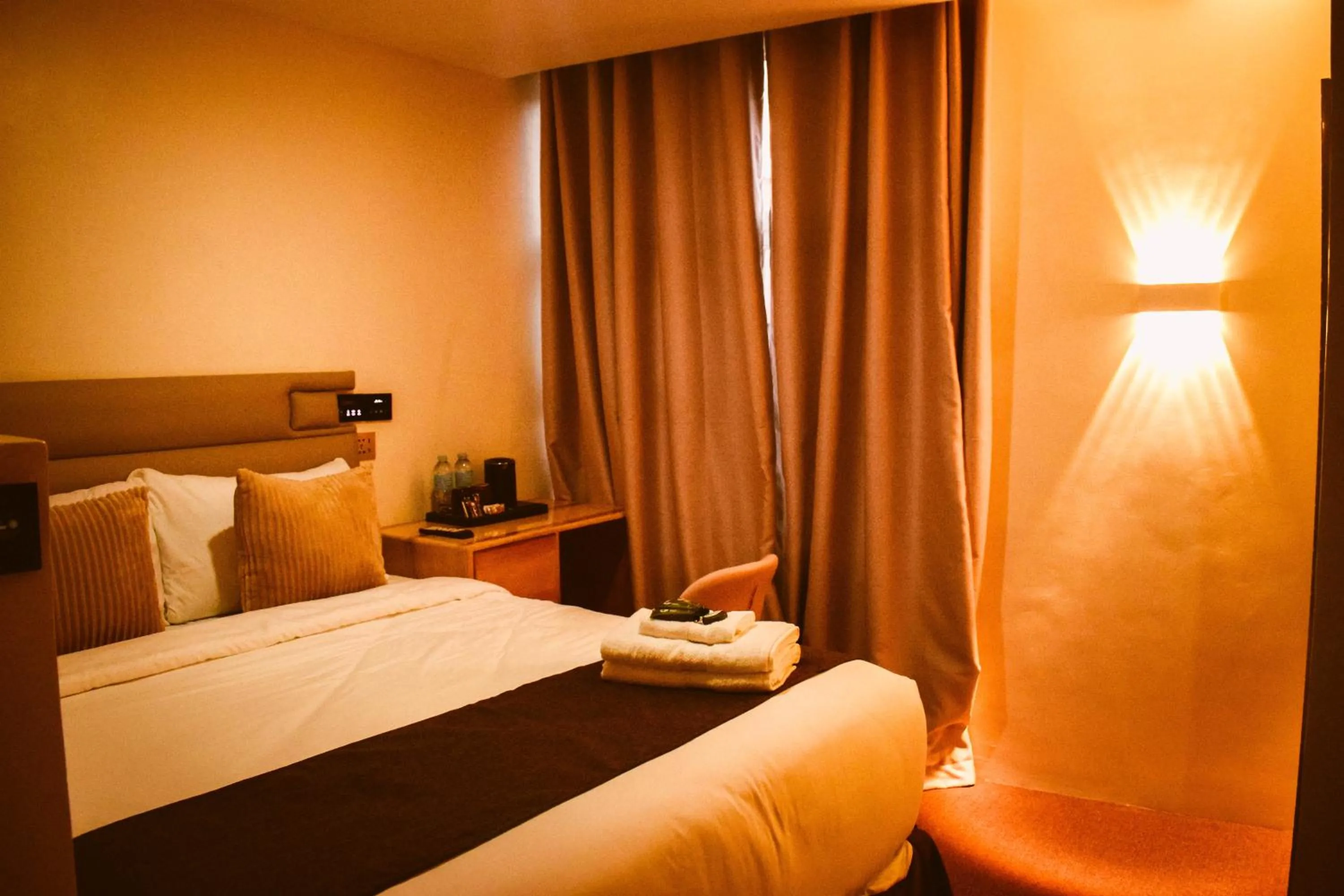 Bed in Cebu Dulcinea Hotel and Suites-MACTAN AIRPORT HOTEL