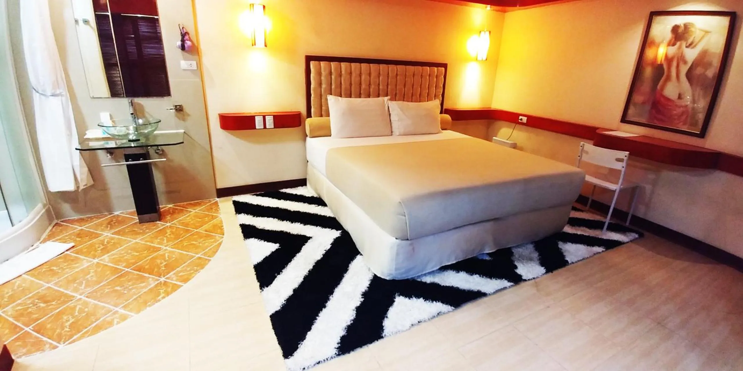 Photo of the whole room, Bed in Cebu Dulcinea Hotel and Suites-MACTAN AIRPORT HOTEL