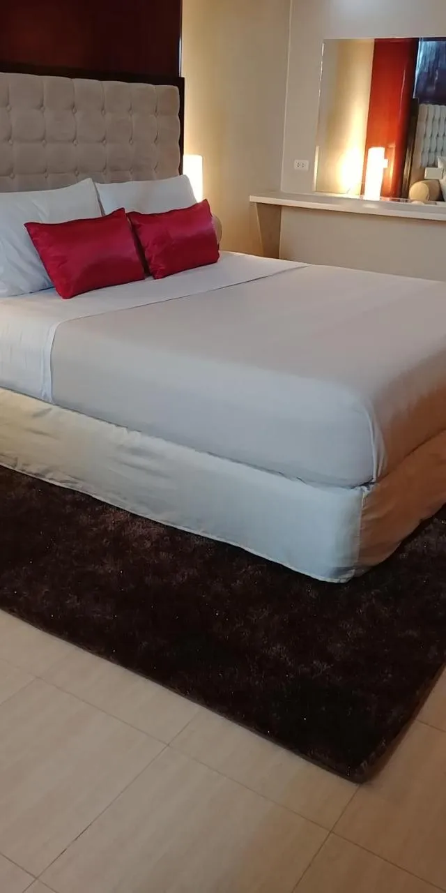 Photo of the whole room, Bed in Cebu Dulcinea Hotel and Suites-MACTAN AIRPORT HOTEL