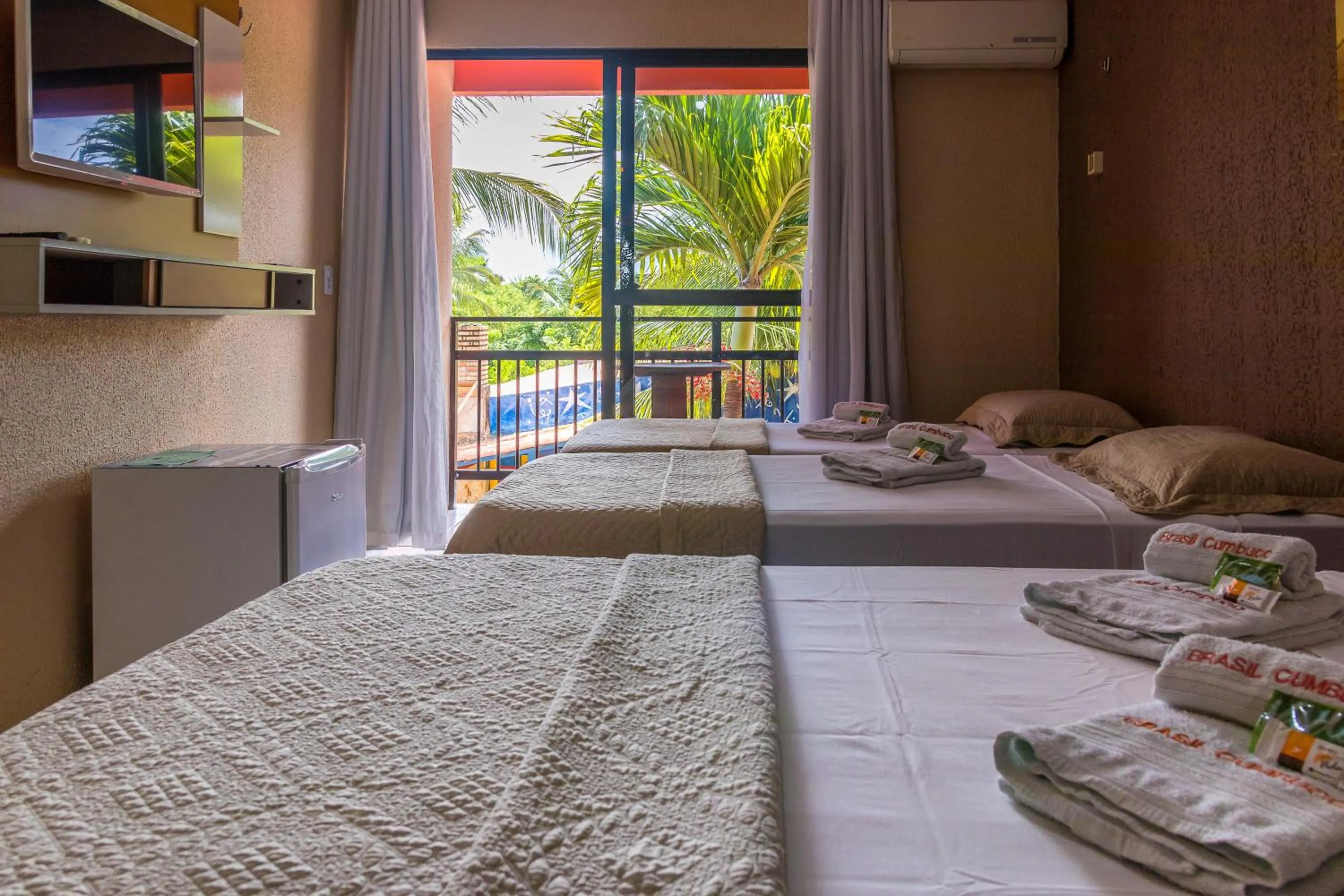 Bed in Pousada Brasil Cumbuco