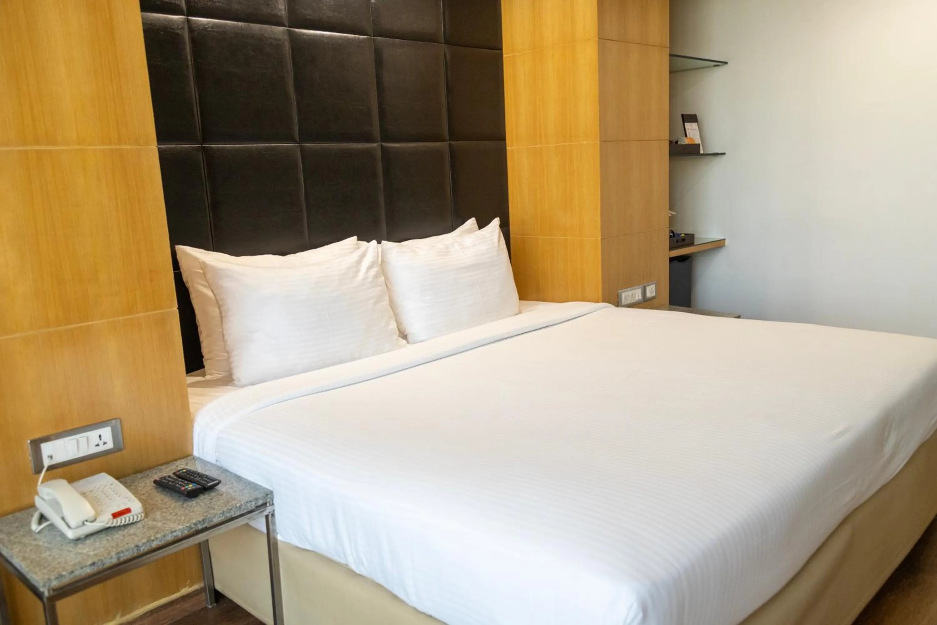 Bed in Ramee Guestline Hotel Dadar