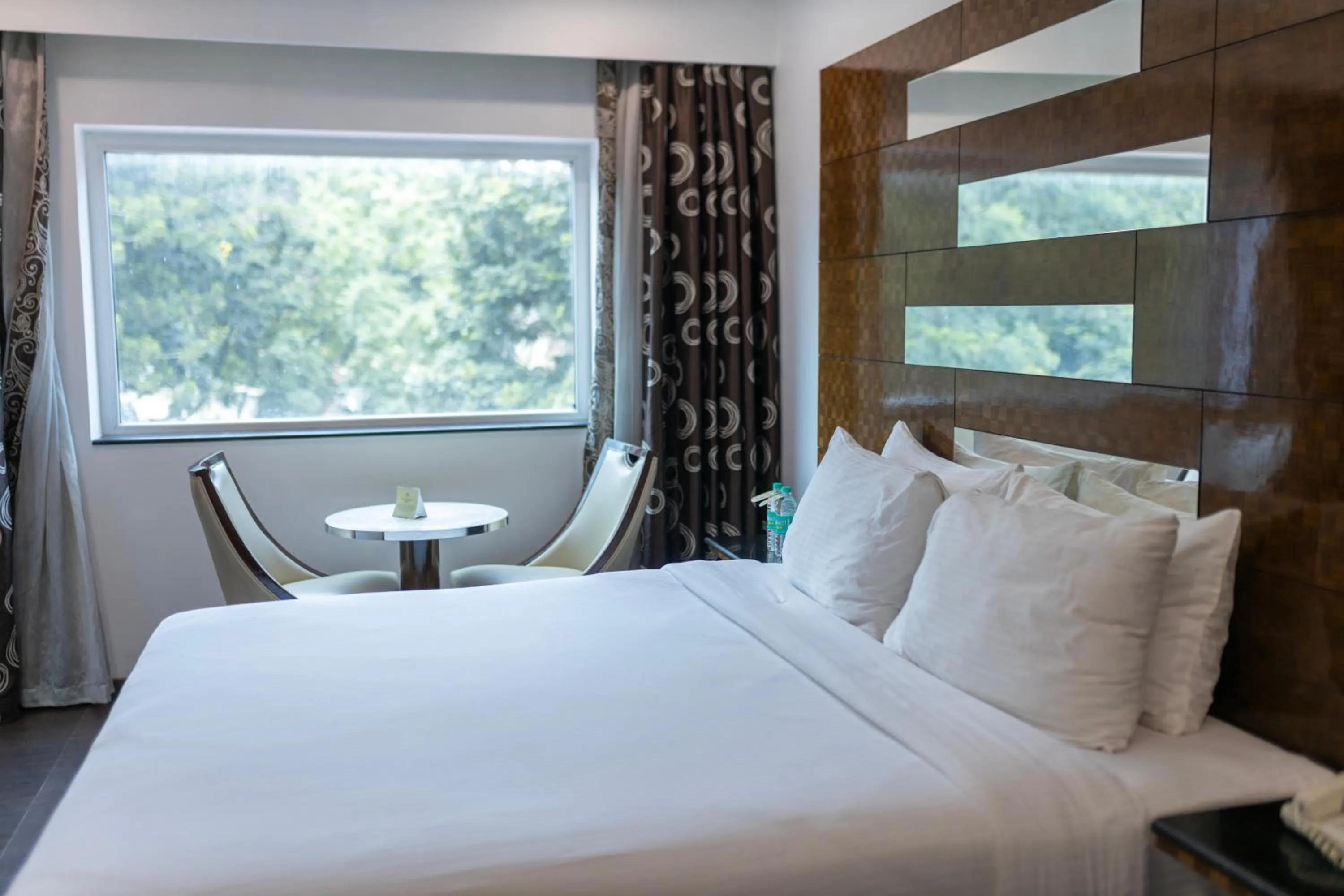 Bed in Ramee Guestline Hotel Bangalore