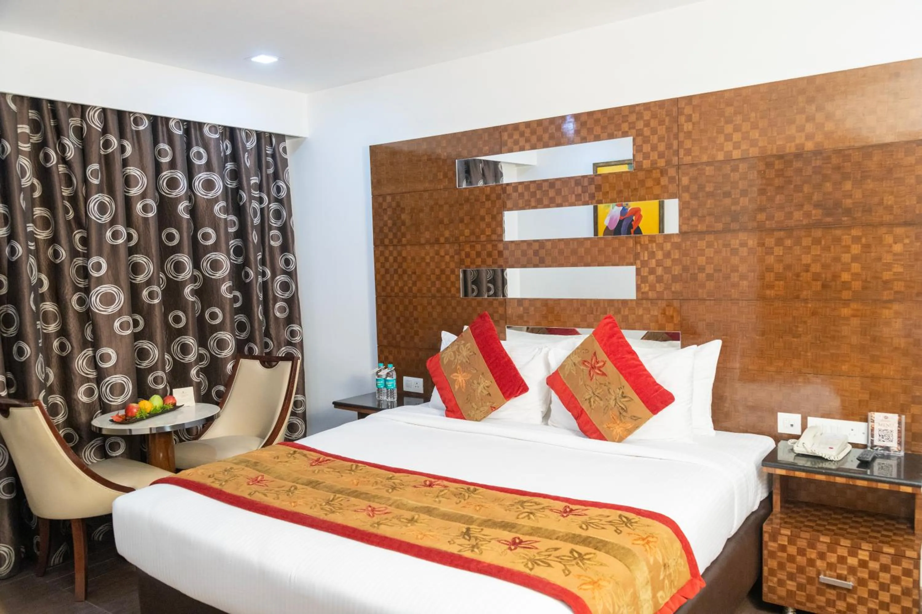 Bed in Ramee Guestline Hotel Bangalore