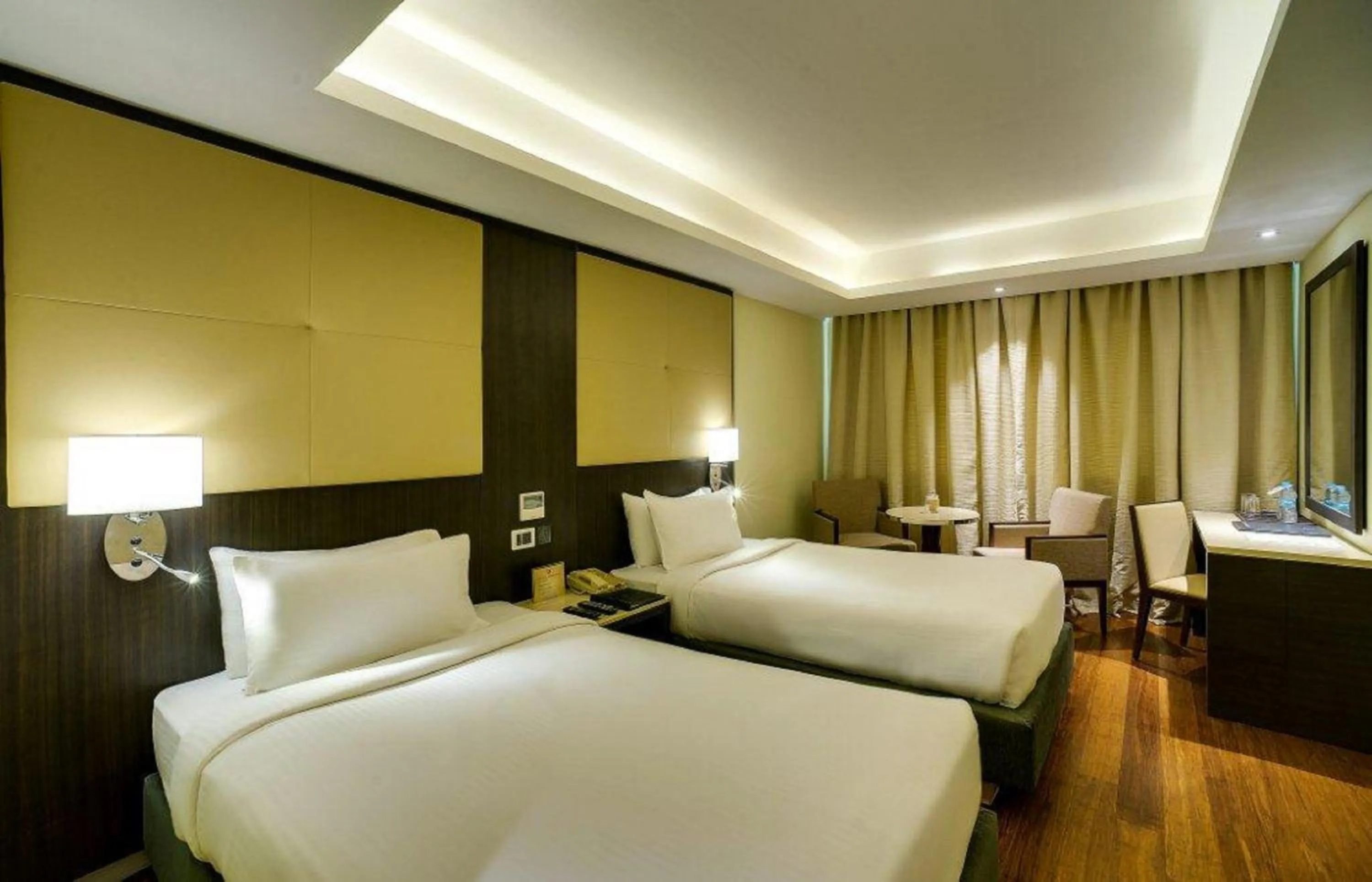 Bed in Ramee Guestline Hotel Bangalore