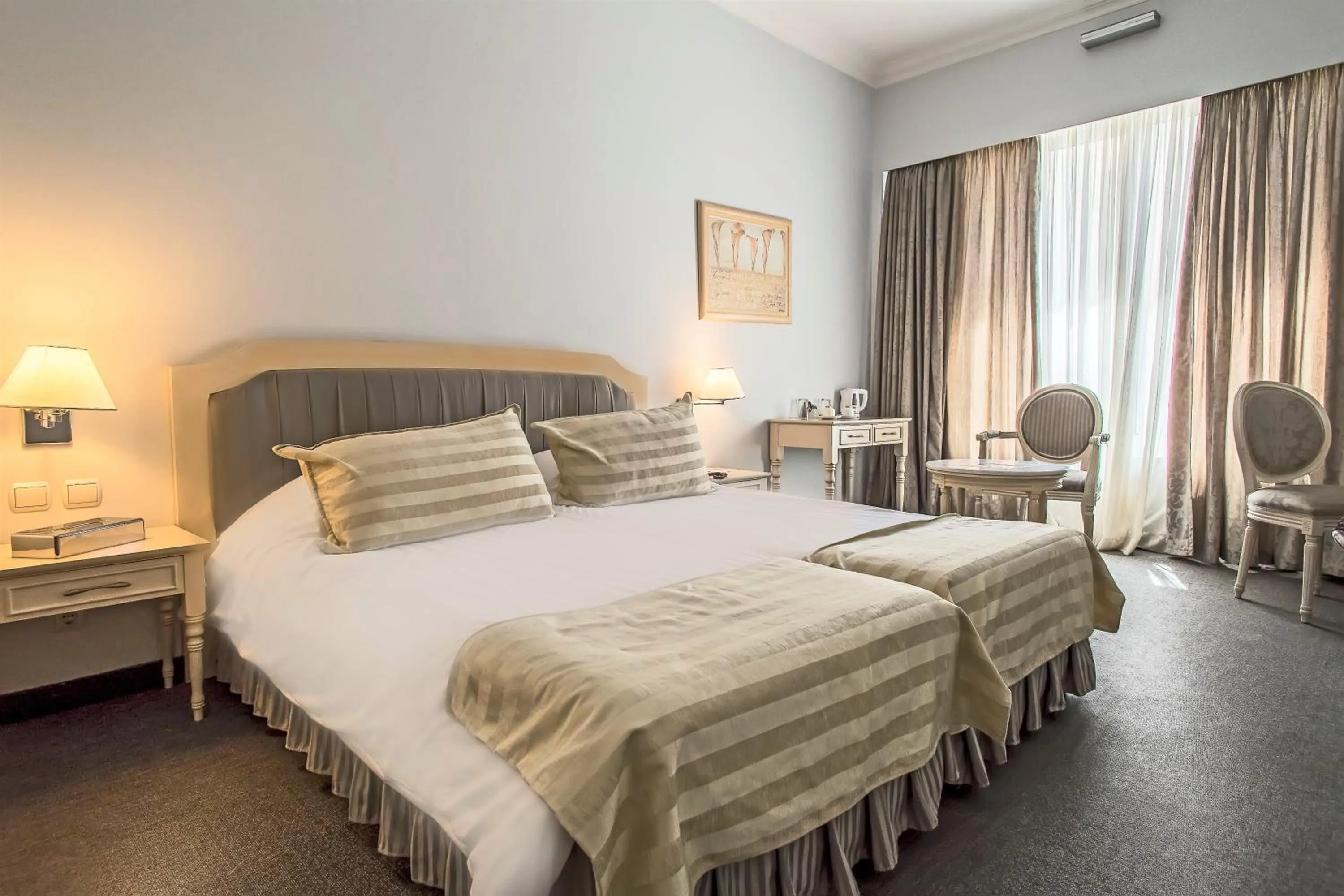 Bed in Airotel Stratos Vassilikos Hotel