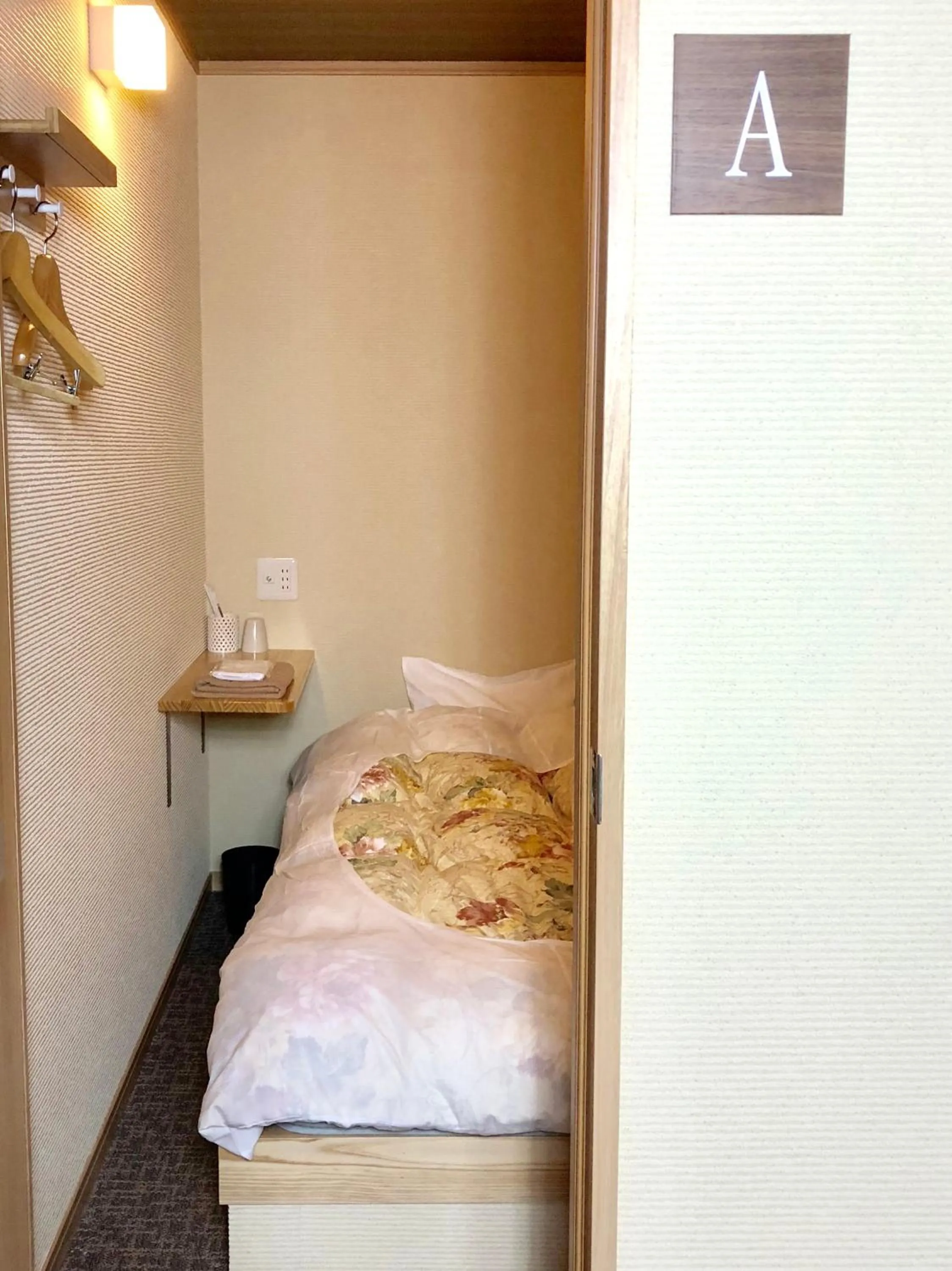 Bed in Onsen Guest House Aobato no Su