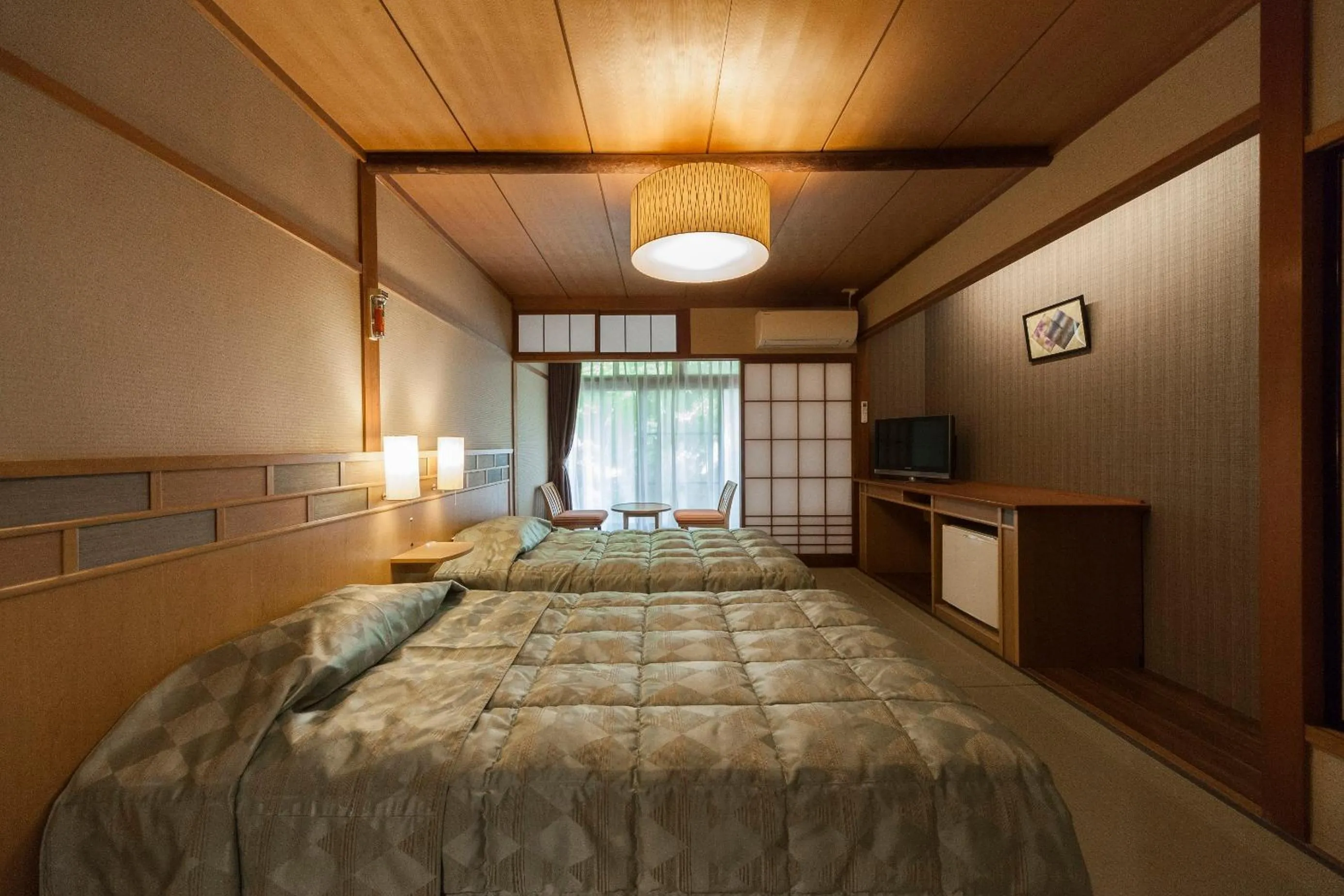 Bed in Onsen Guest House Aobato no Su