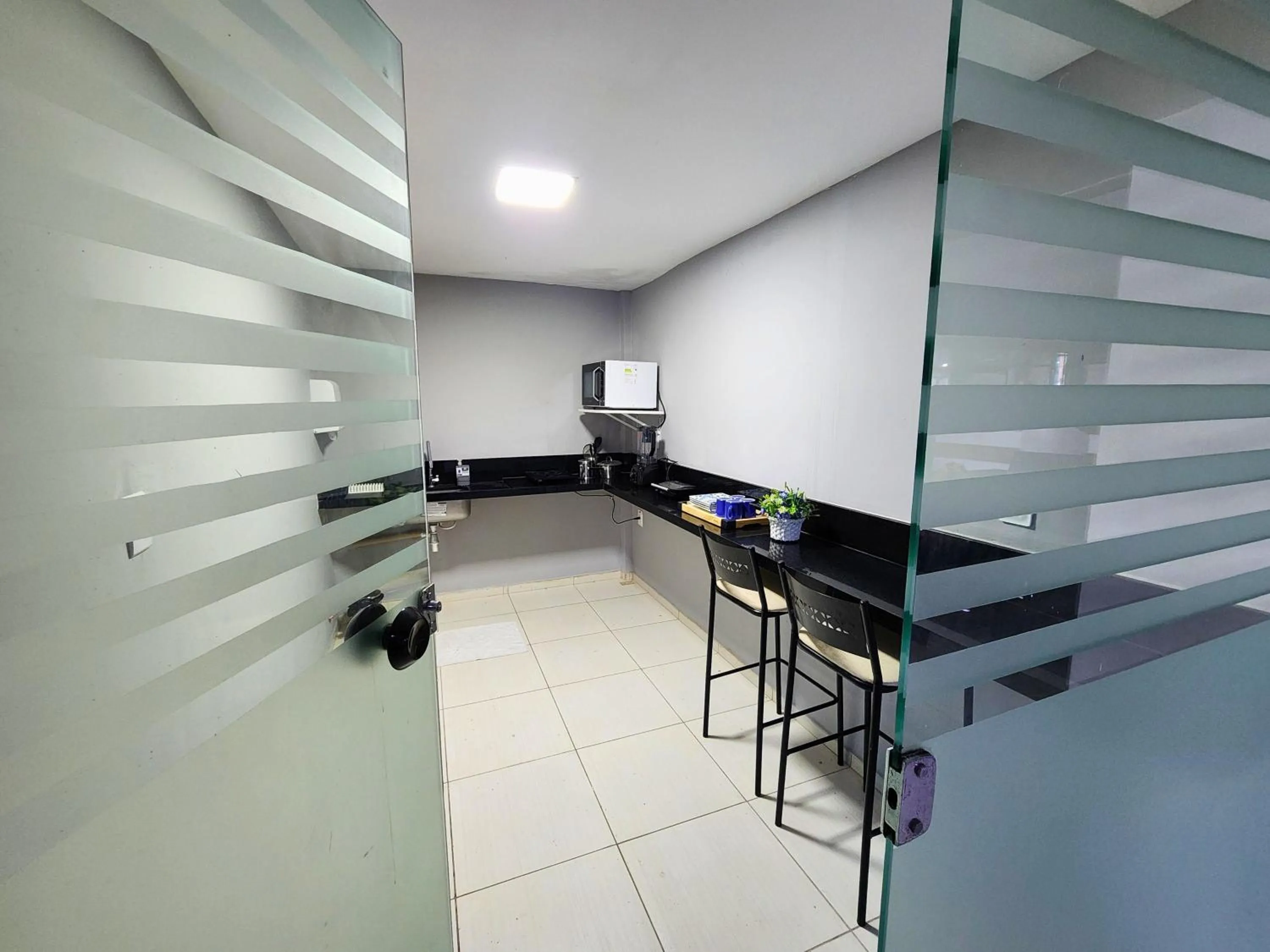 Kitchen or kitchenette in JR Hotel