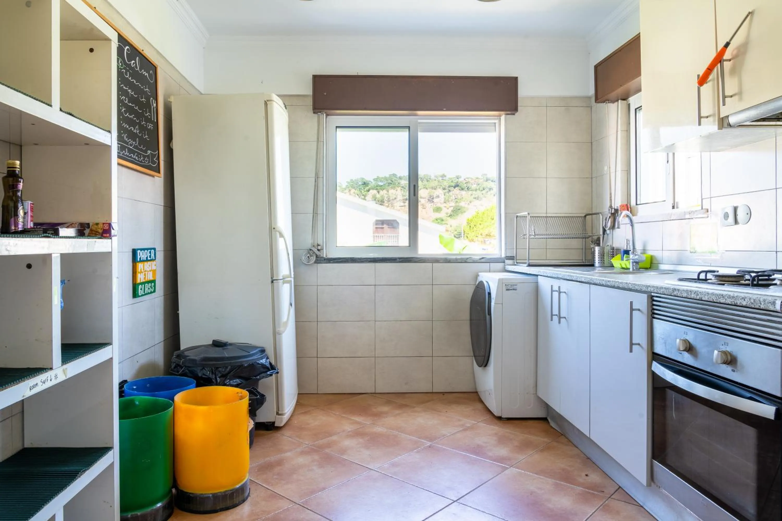 Communal kitchen in Natural Mystic Hostel