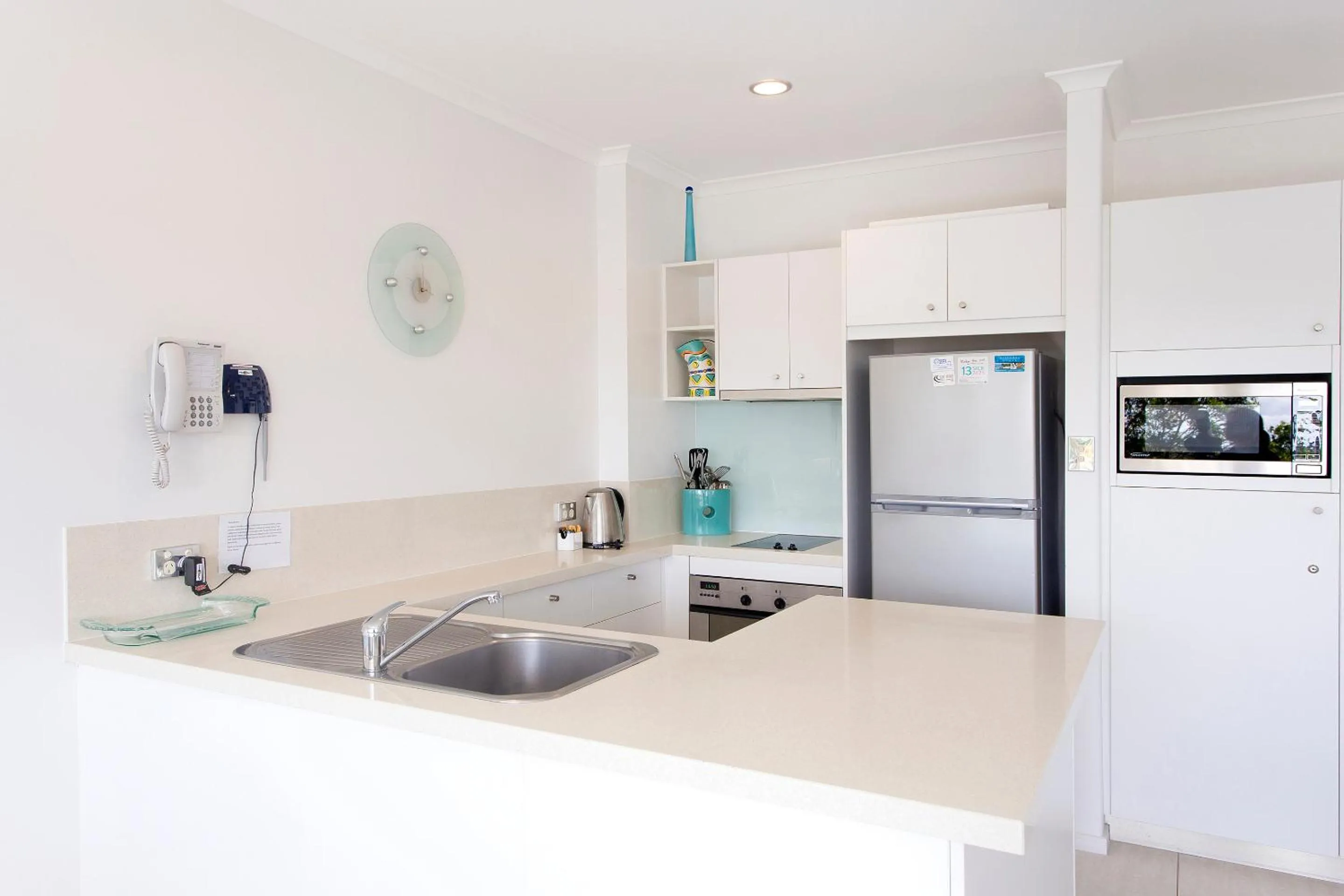 Kitchen or kitchenette in Offshore Noosa Resort