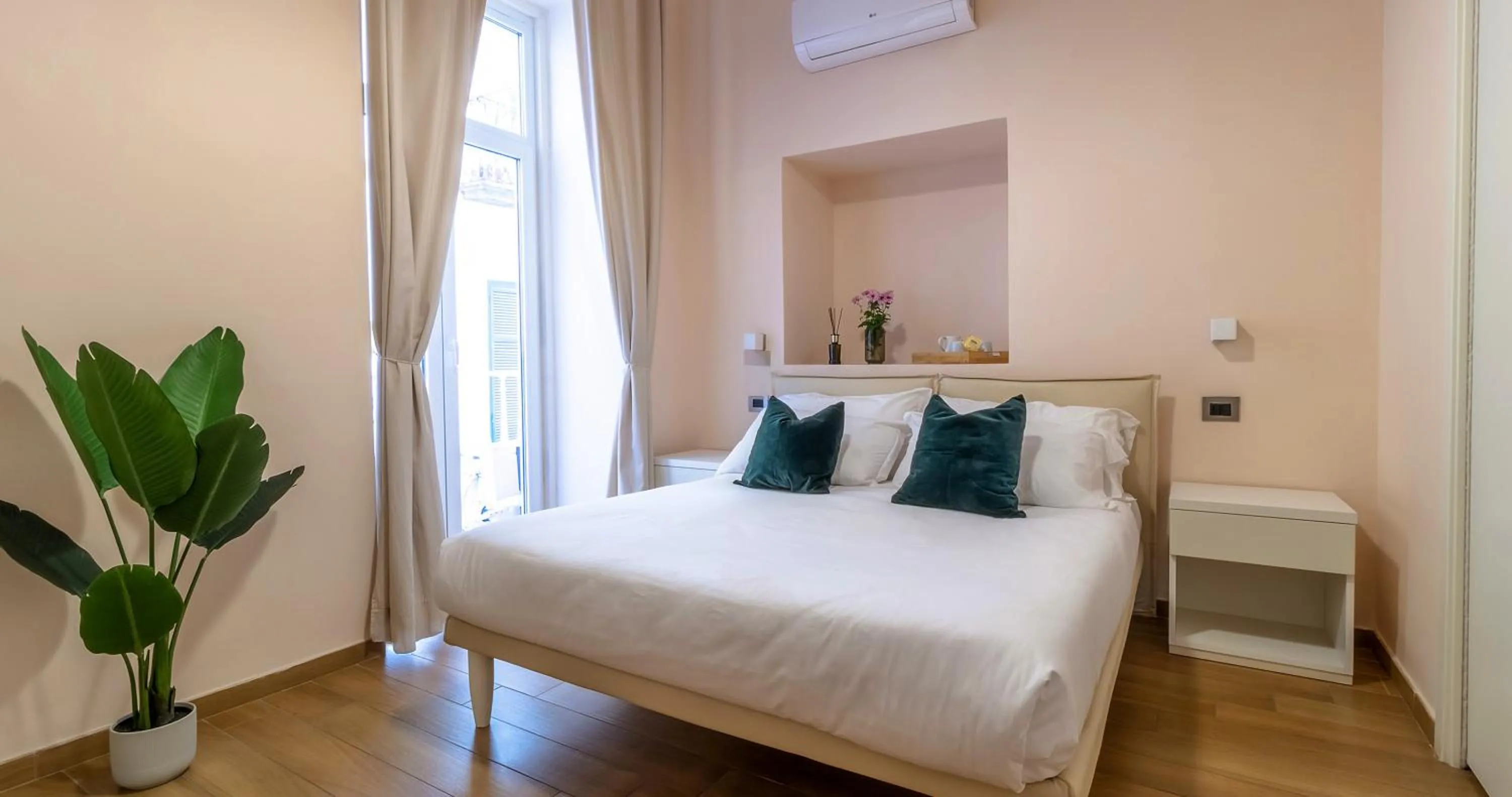 Bed in Musto Suites & Rooms