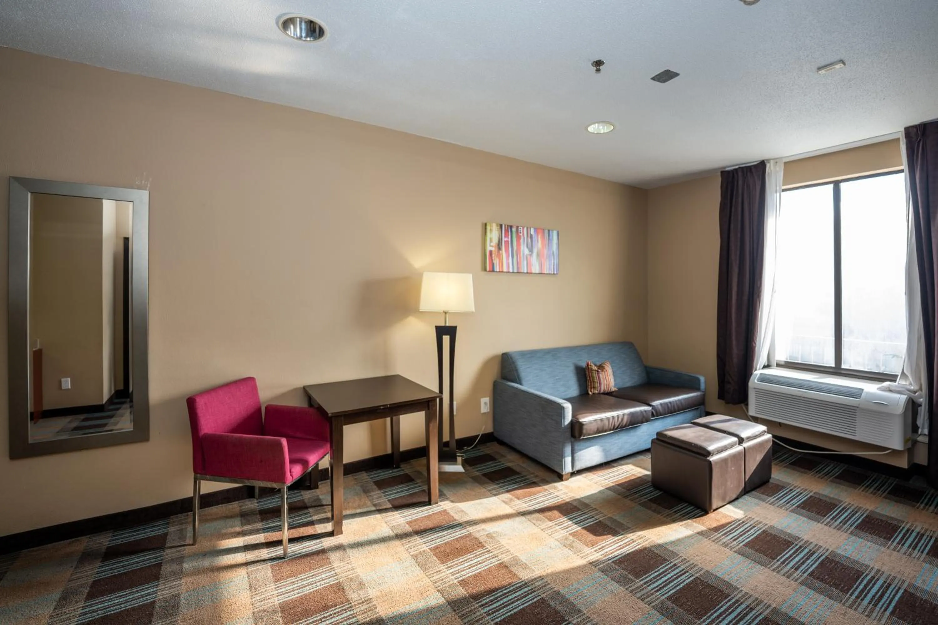 Living room, Bed in Comfort Suites Houston West at Clay Road