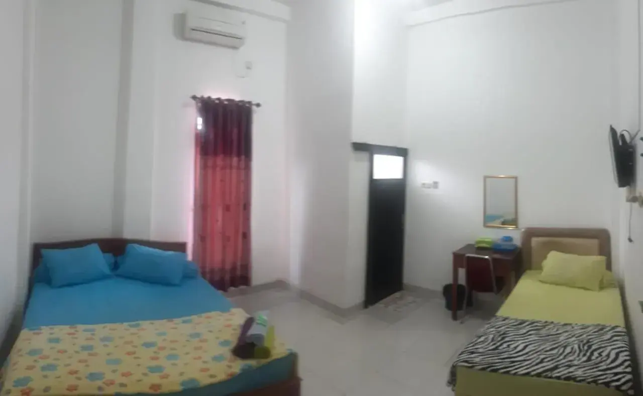 Bed in Losmen Ibu Hj. Tarjo Bed in Losmen Ibu Hj. Tarjo