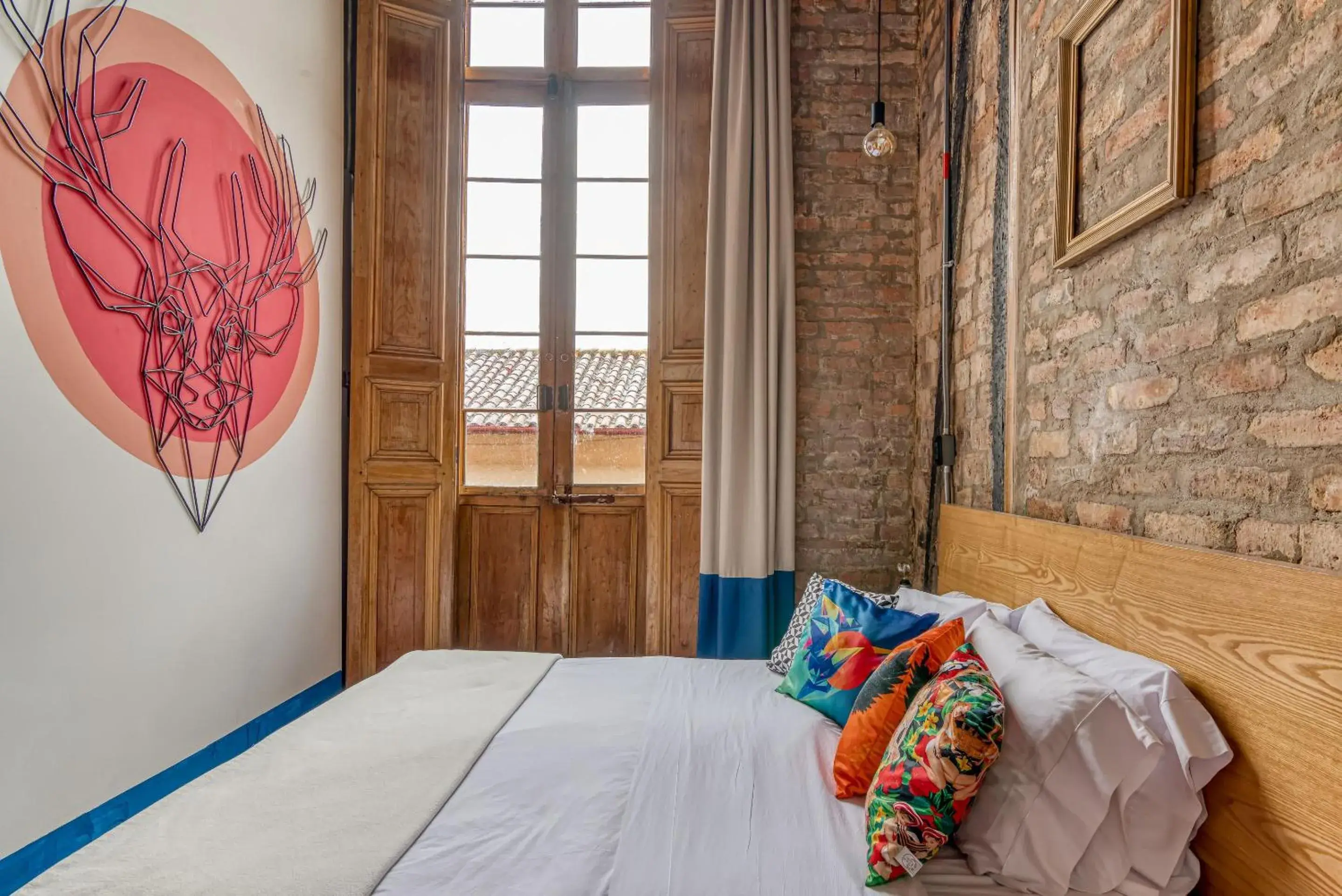 Bed in Delgadillo Hotel by Socialtel Bed in Delgadillo Hotel by Socialtel