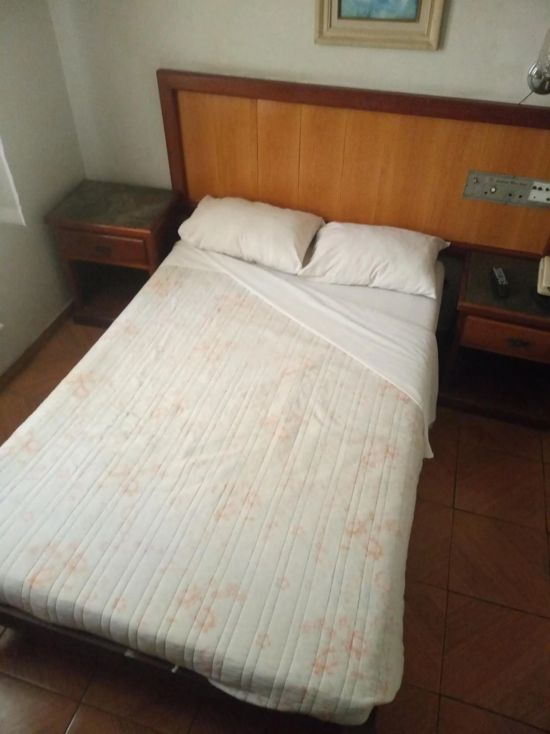 Bed in Reinales Plaza Hotel