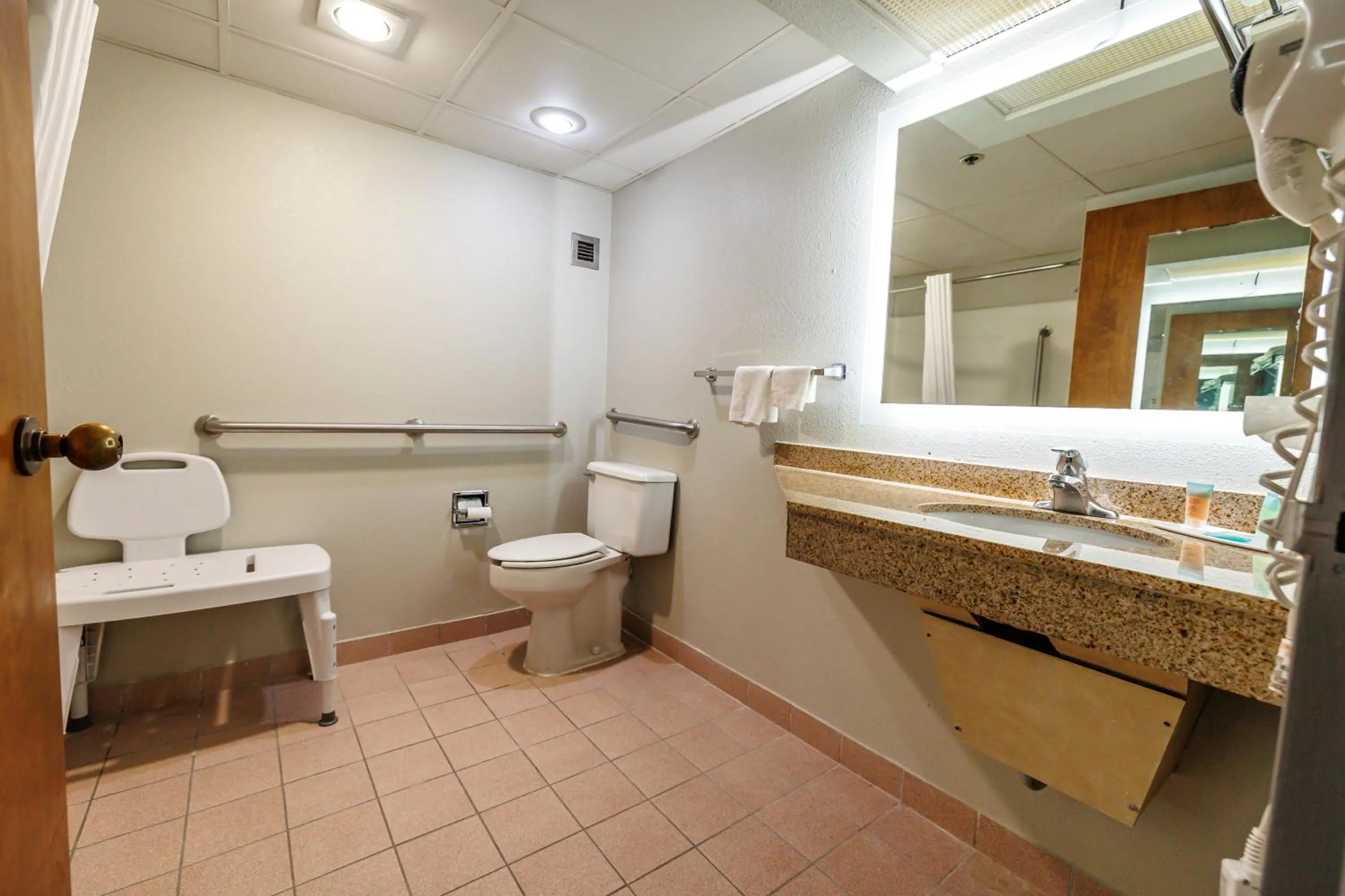 Toilet in New Victorian Inn & Suites Omaha