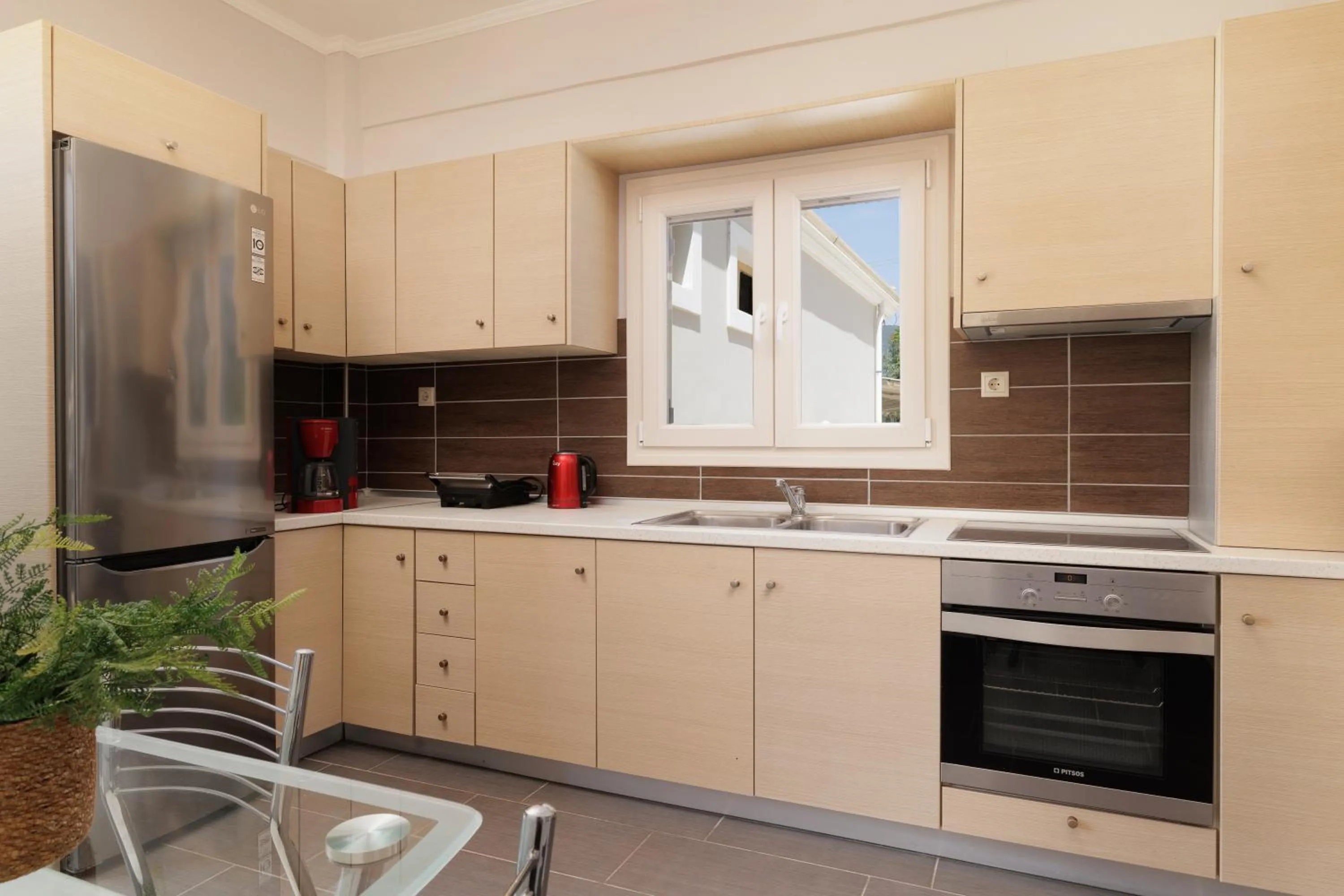 Kitchen or kitchenette in Santos Luxury Apartments