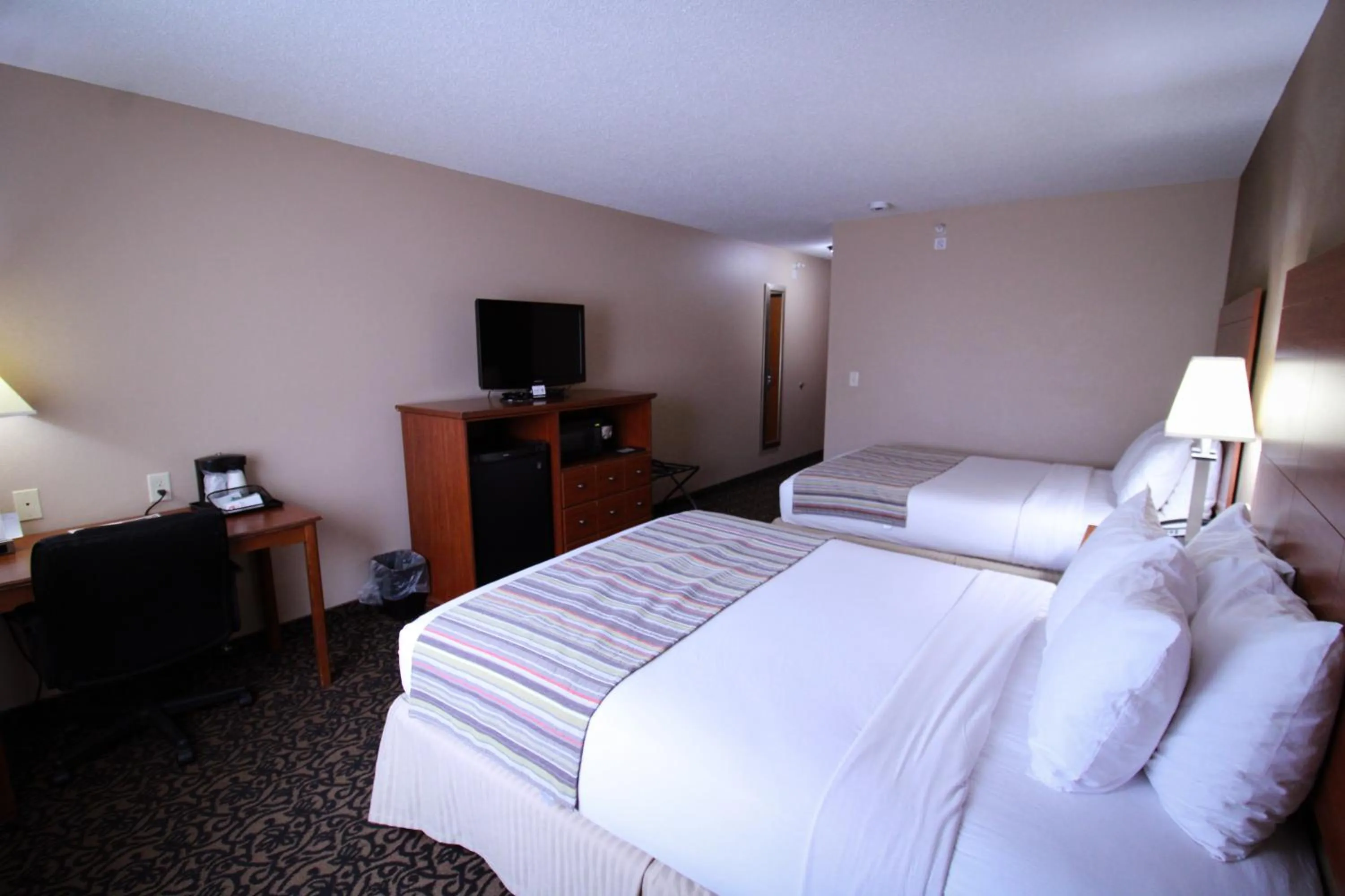 Bed in Canby Inn and Suites