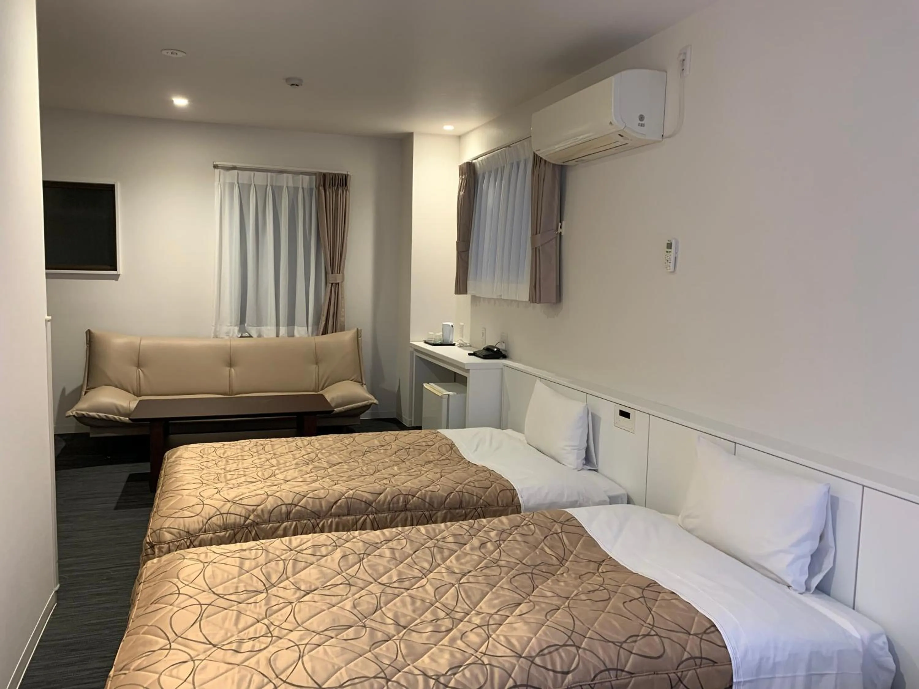 Bed in Hotel New Tohoku