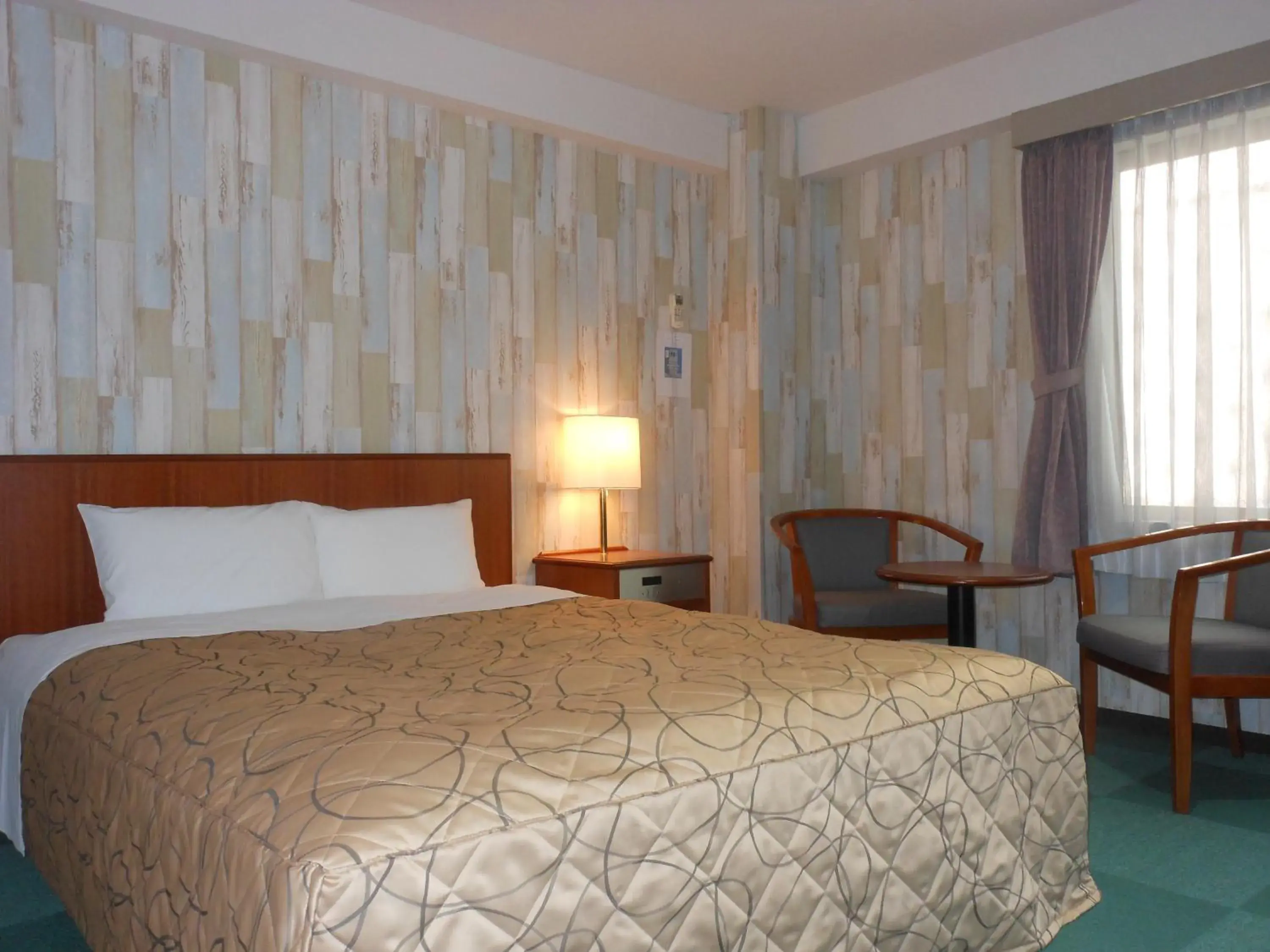 Bed in Hotel New Tohoku Bed in Hotel New Tohoku