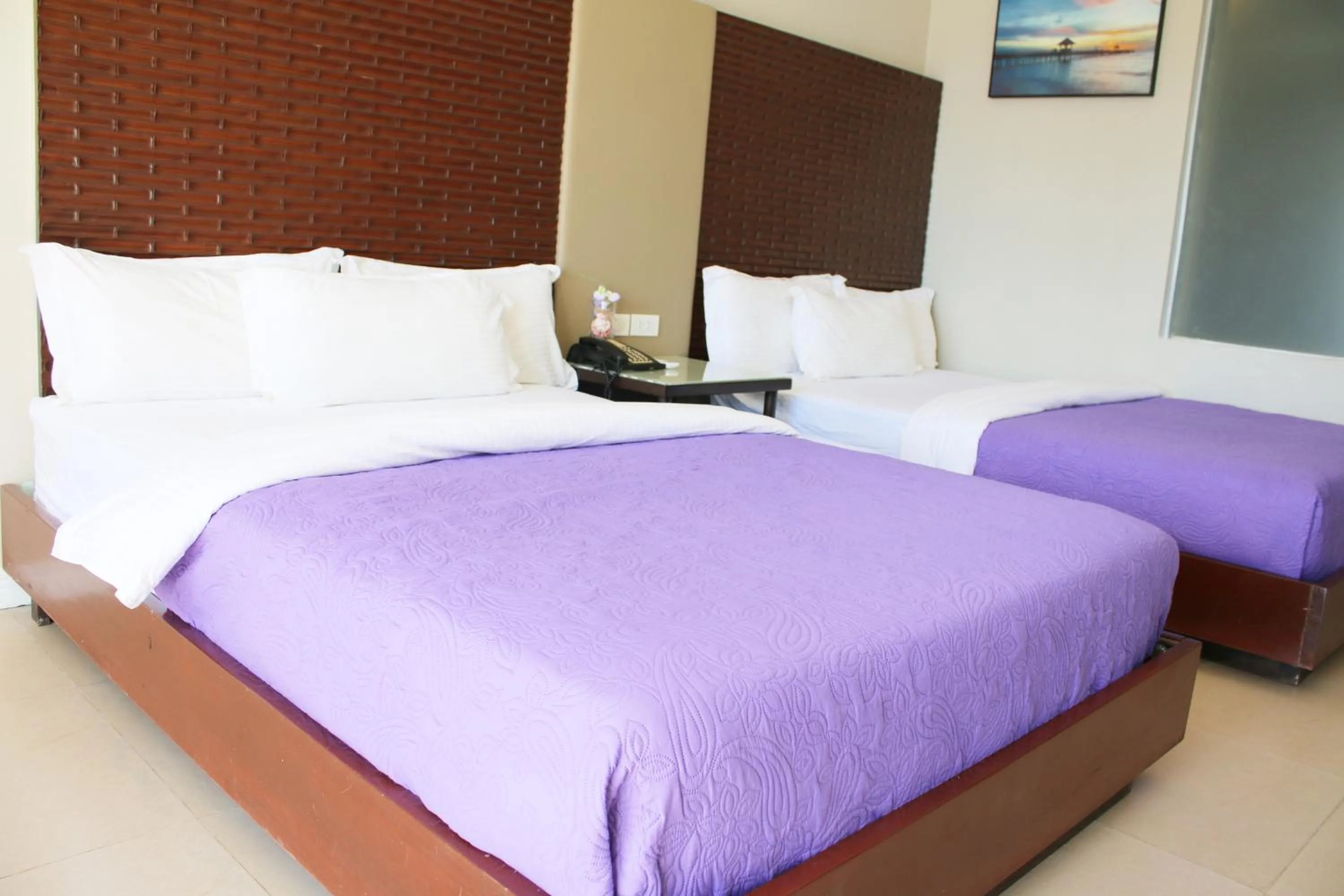 Bed in The Muse Beach Front Hotel Boracay