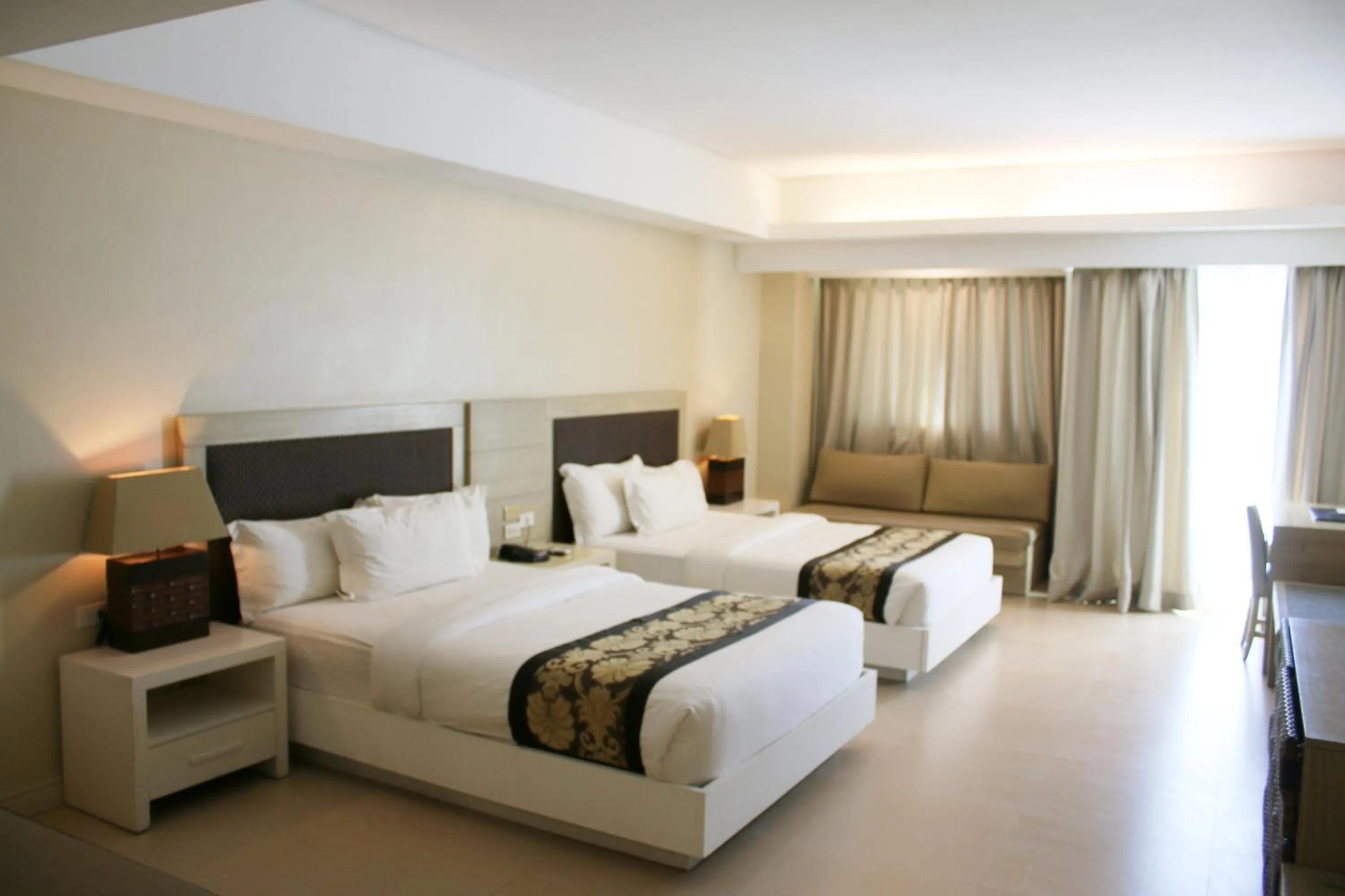 Bed in The Muse Beach Front Hotel Boracay