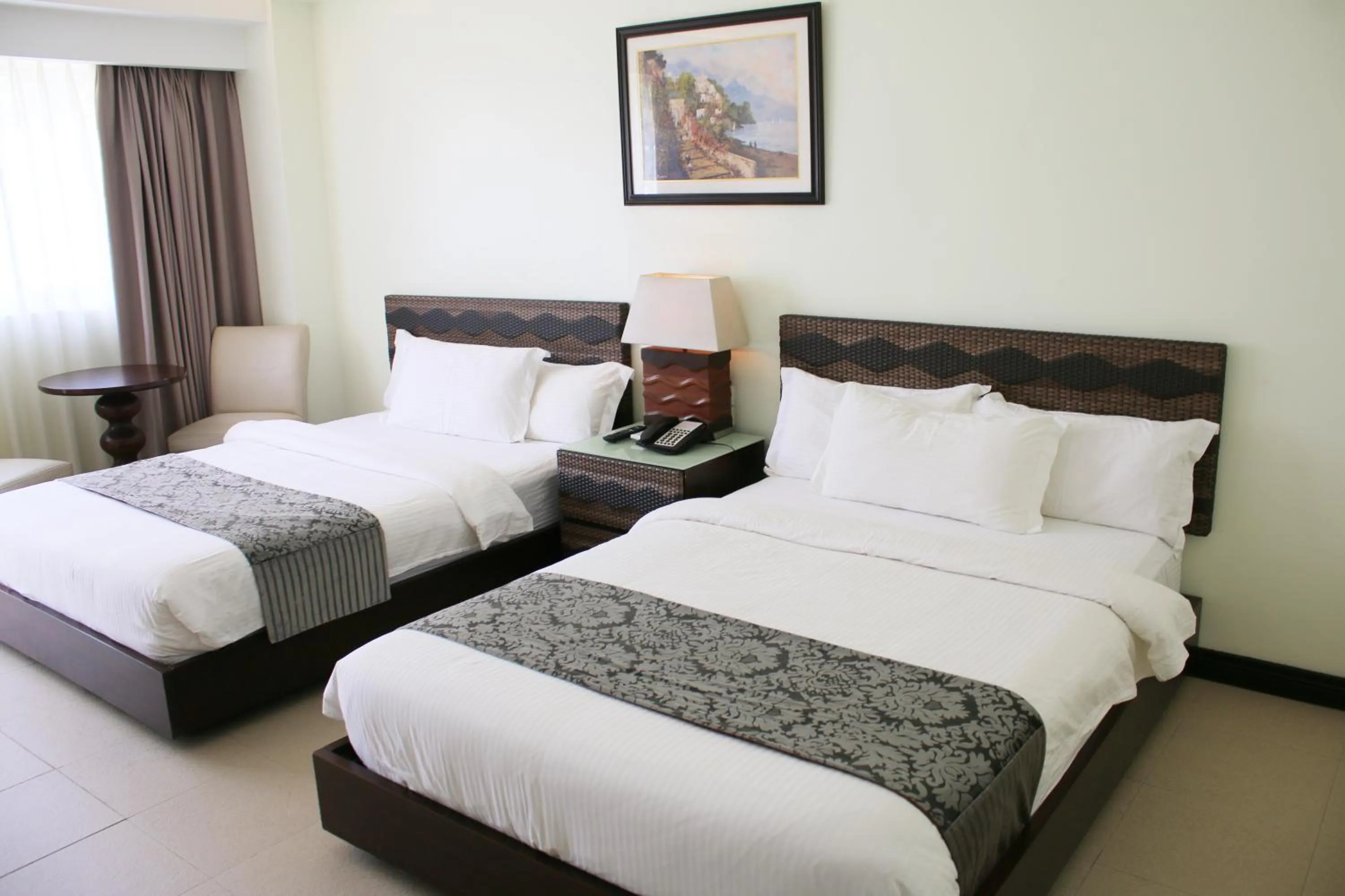 Bed in The Muse Beach Front Hotel Boracay