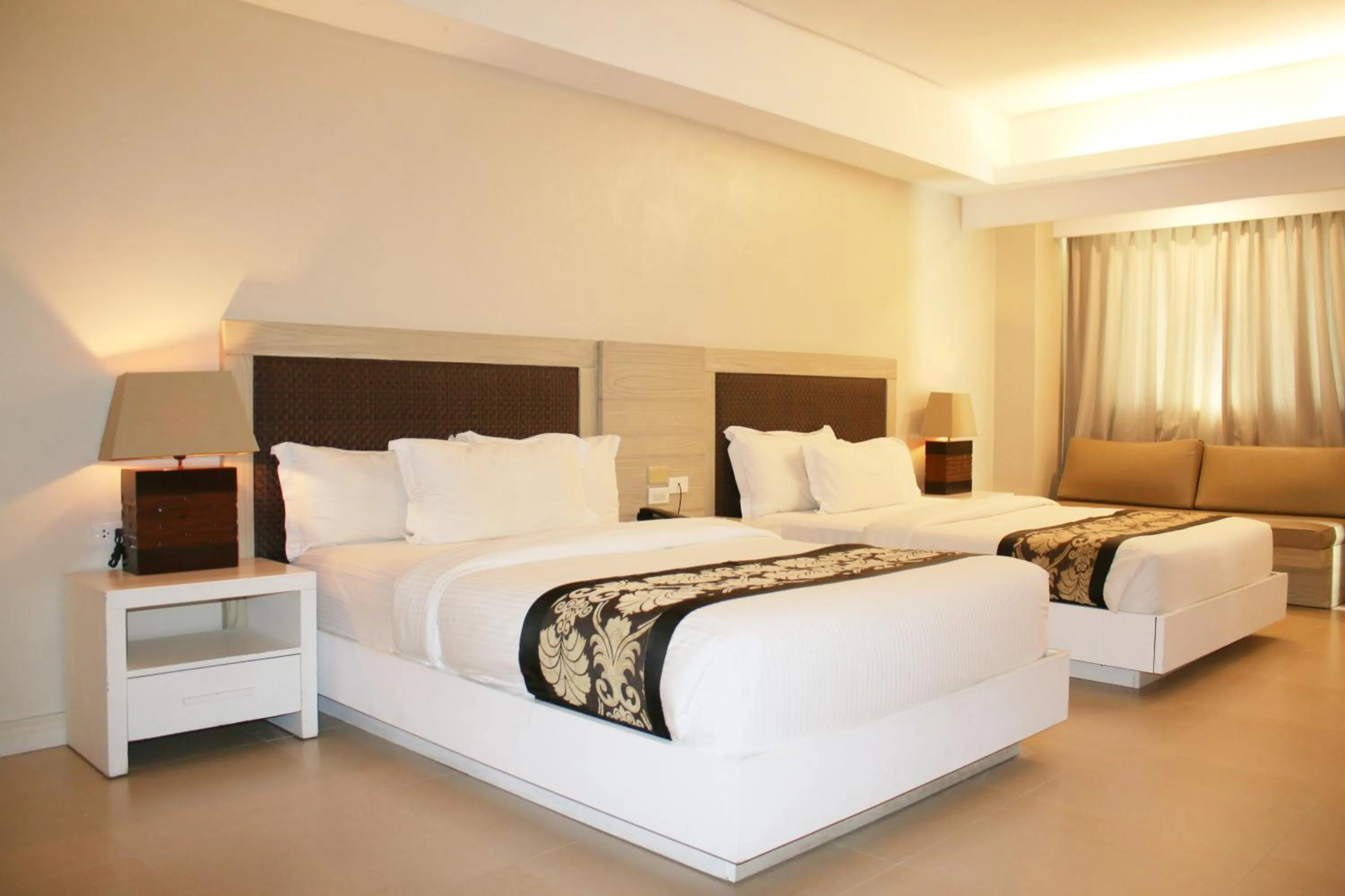 Bed in The Muse Beach Front Hotel Boracay