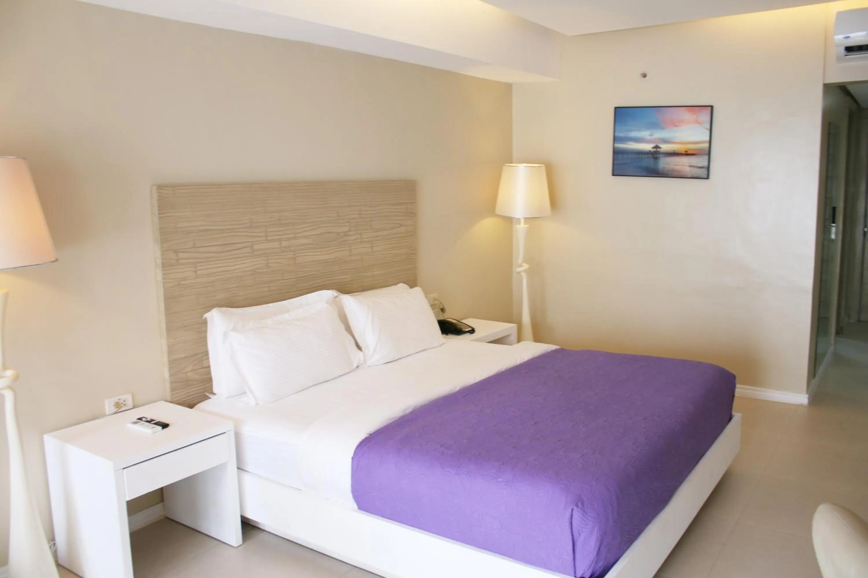 Bed in The Muse Beach Front Hotel Boracay