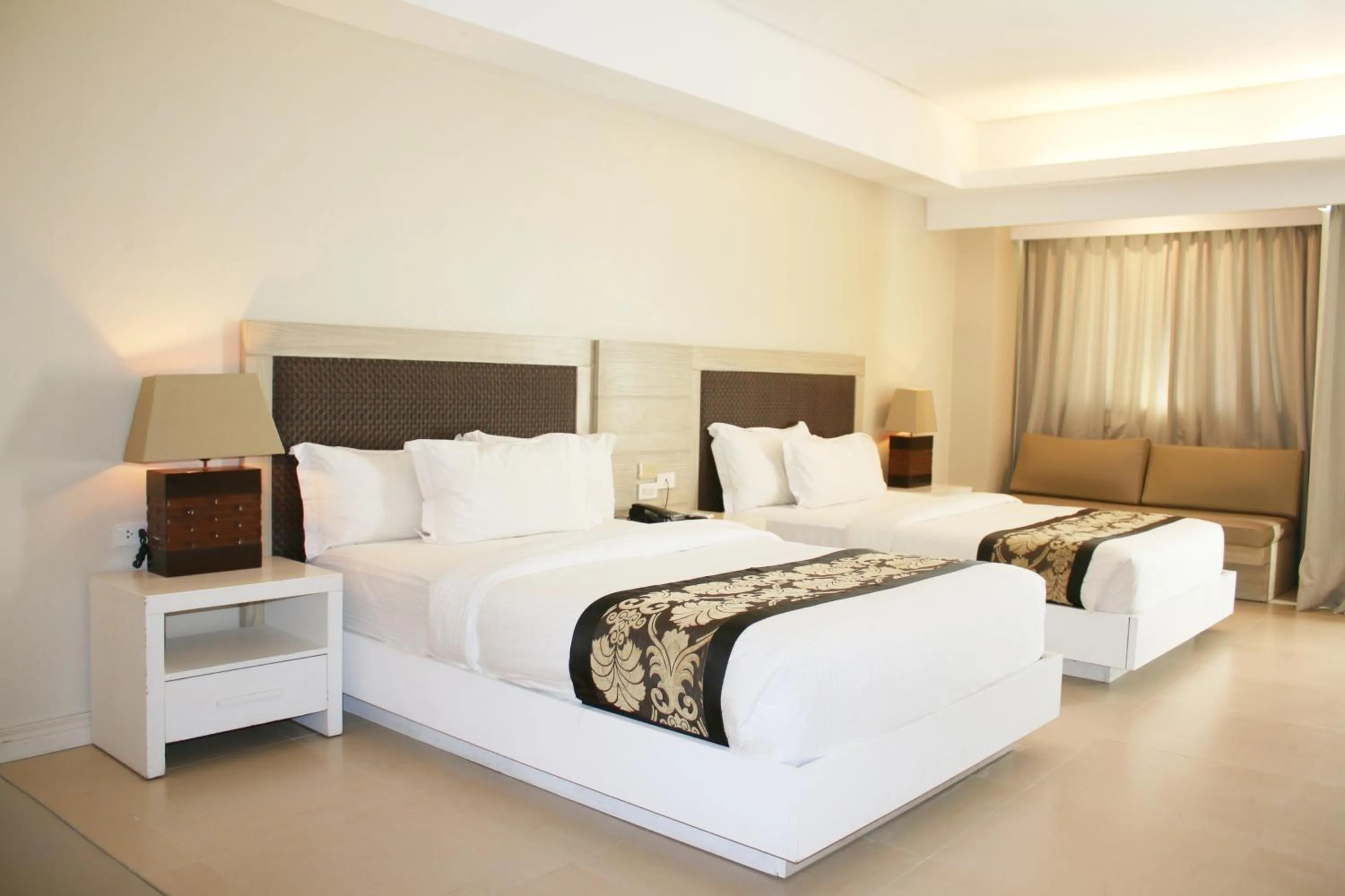 Bed in The Muse Beach Front Hotel Boracay