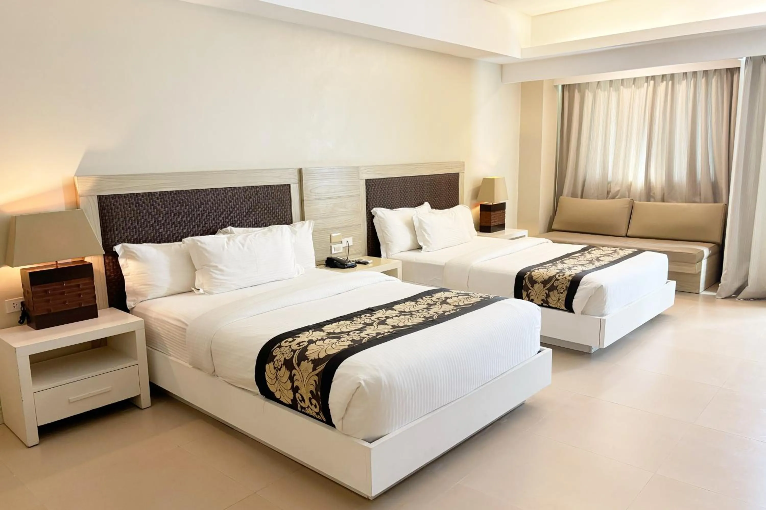 Bed in The Muse Beach Front Hotel Boracay